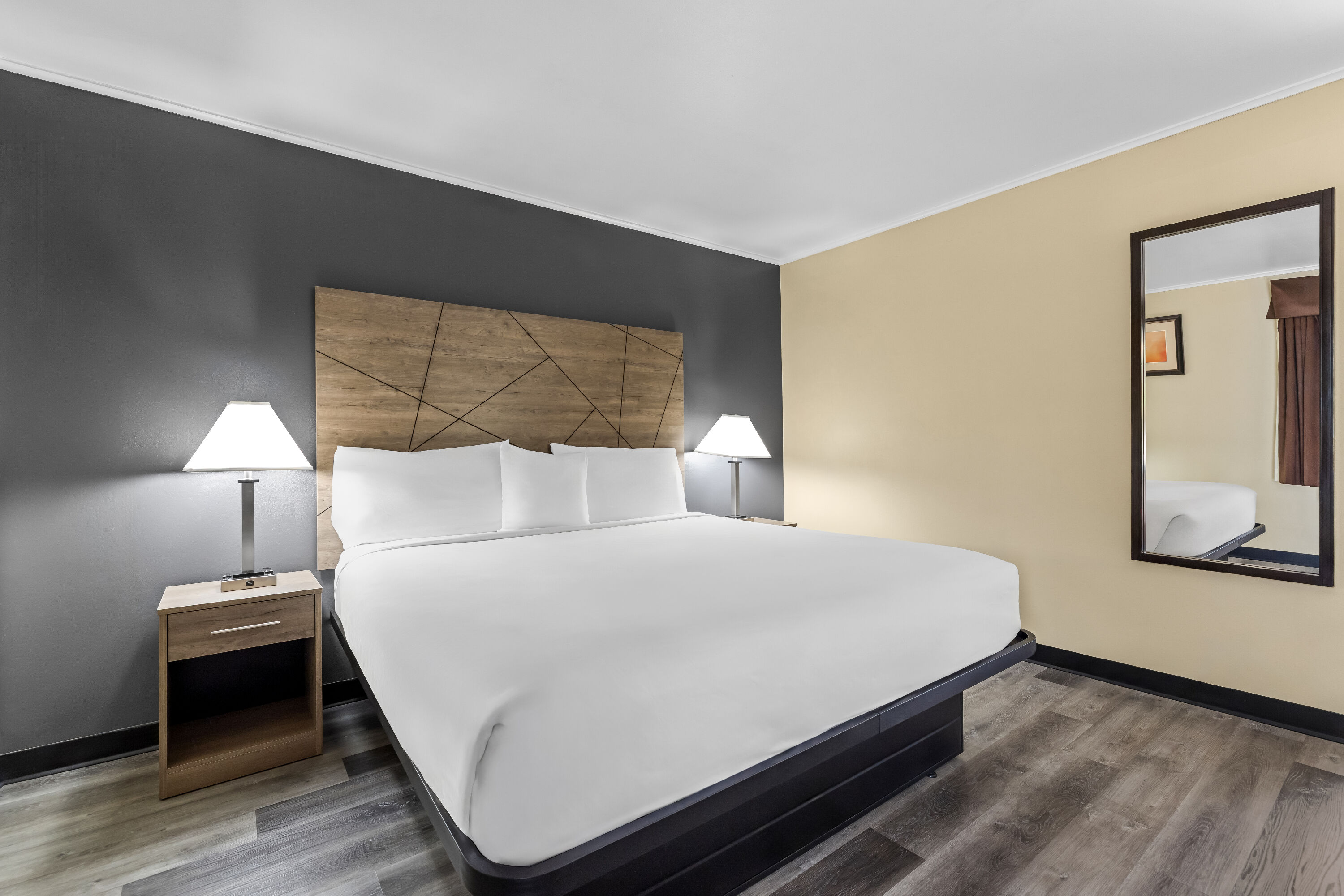 King bed guest room at the Travelodge by Wyndham Rapid City in Rapid City, South Dakota