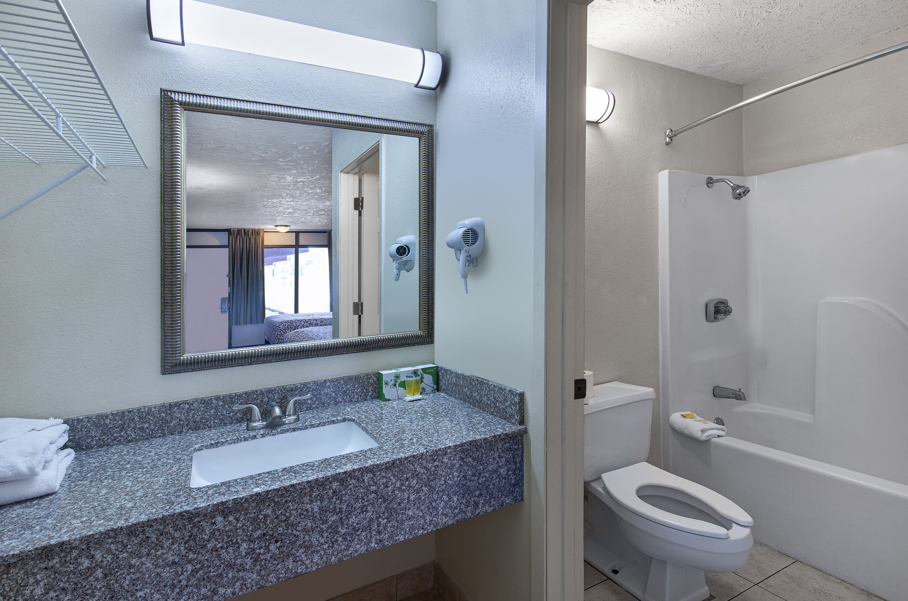 Guest room bath at the Americana Inn a Travelodge by Wyndham in Pigeon Forge, Tennessee