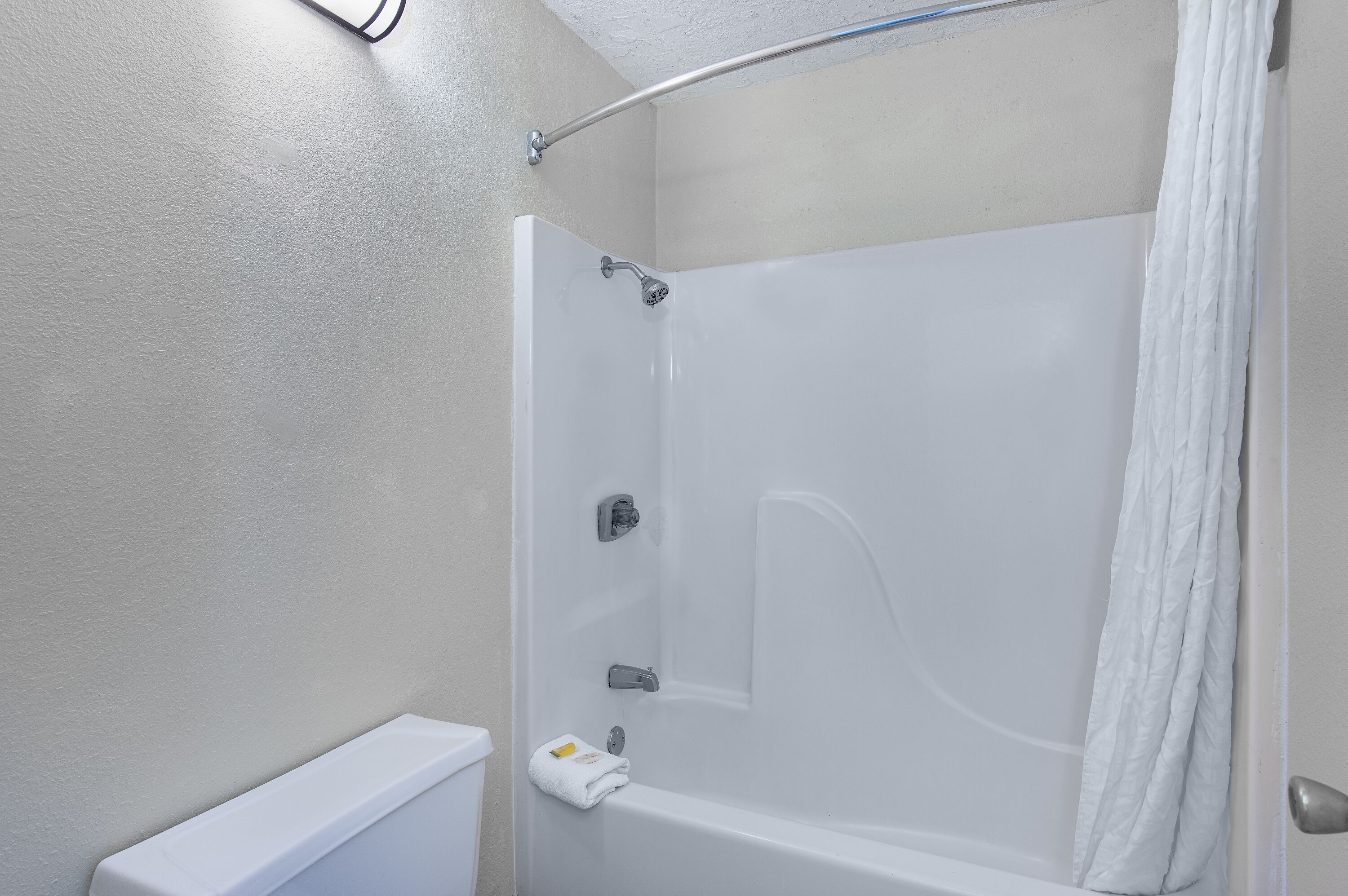 Guest room bath at the Americana Inn a Travelodge by Wyndham in Pigeon Forge, Tennessee