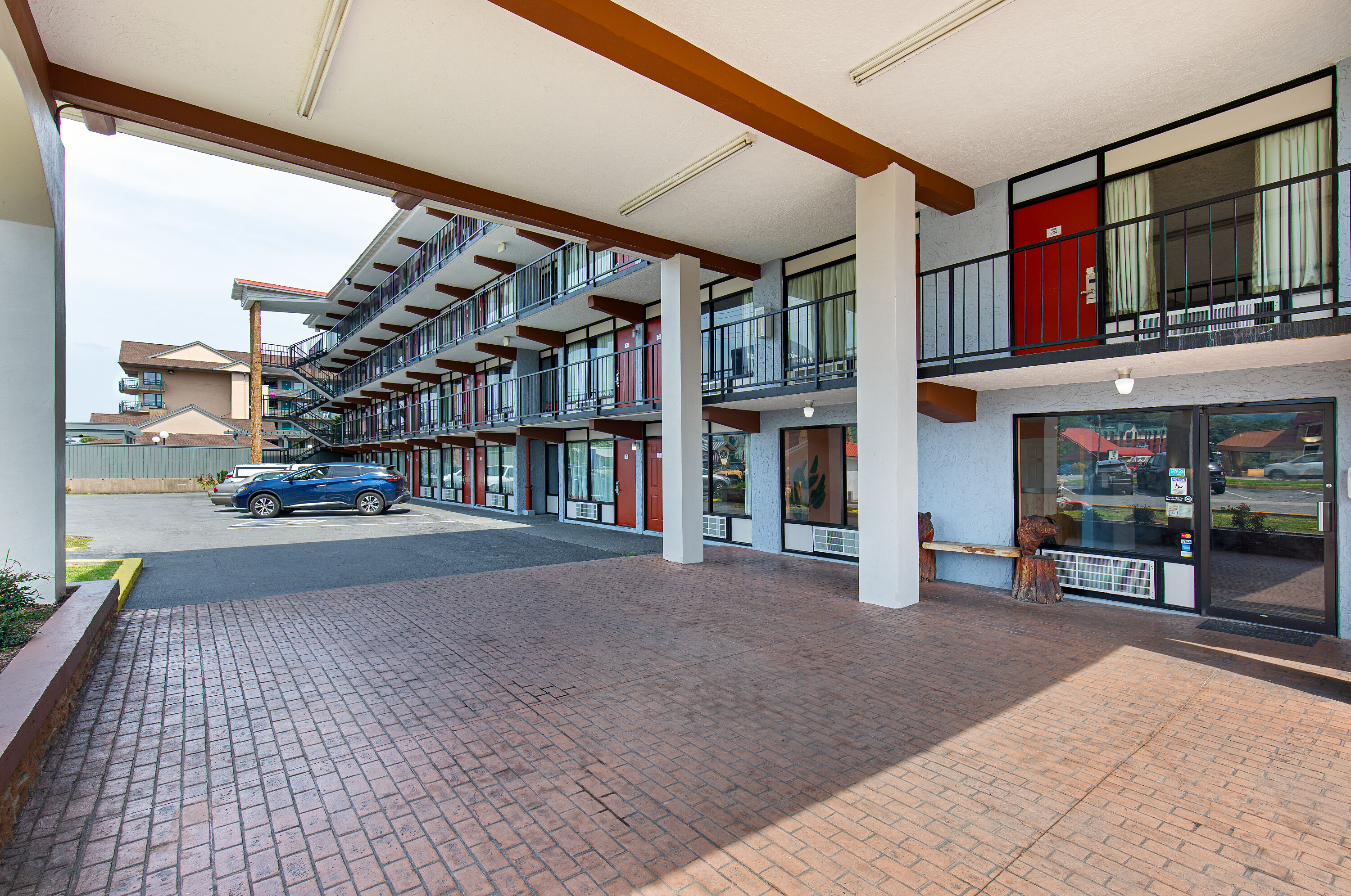 Exterior Day Image of Americana Inn a Travelodge by Wyndham hotel in Pigeon Forge, Tennessee