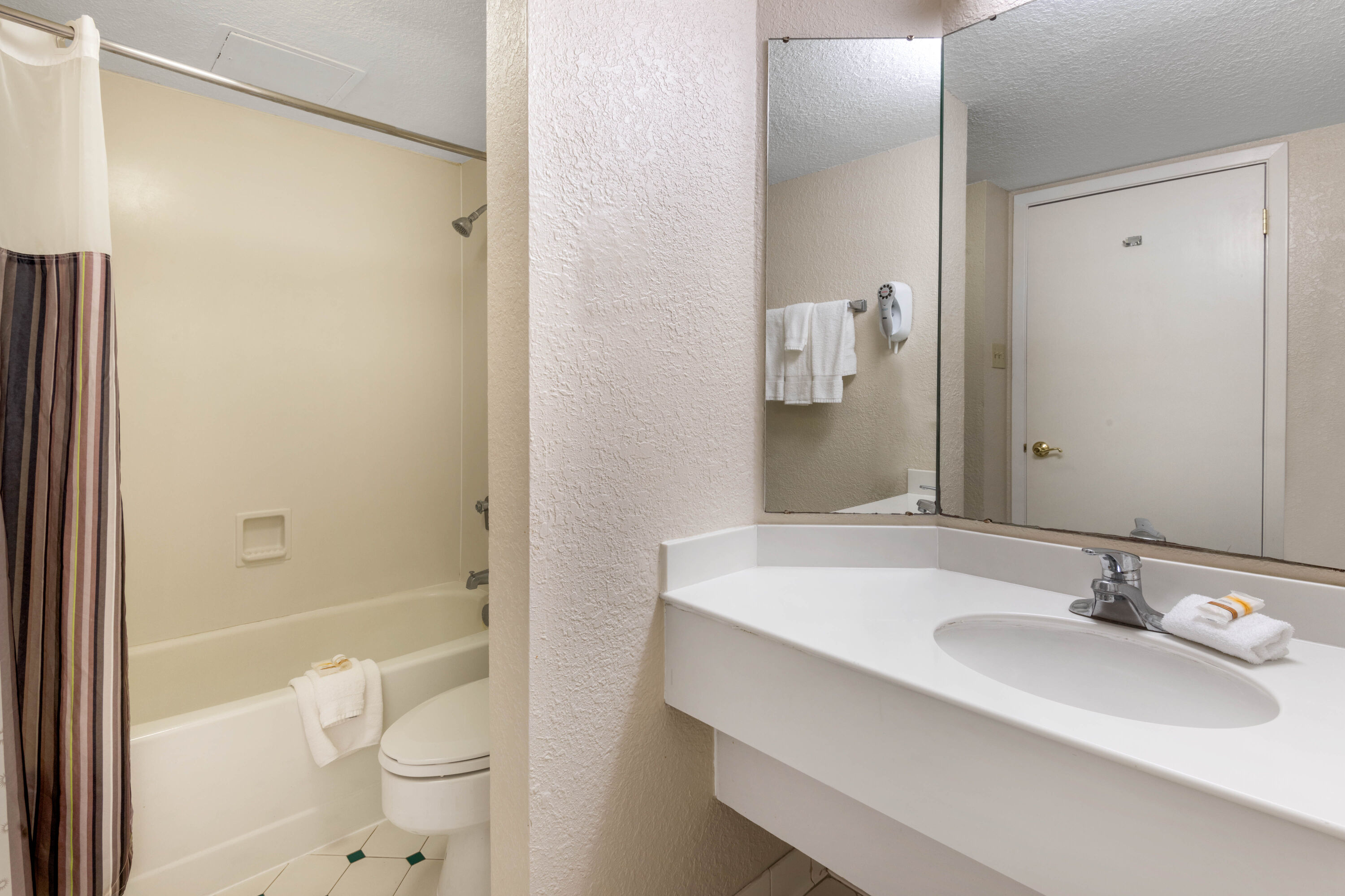 Guest room bath at the Travelodge by Wyndham Amarillo West Medical Center in Amarillo, Texas
