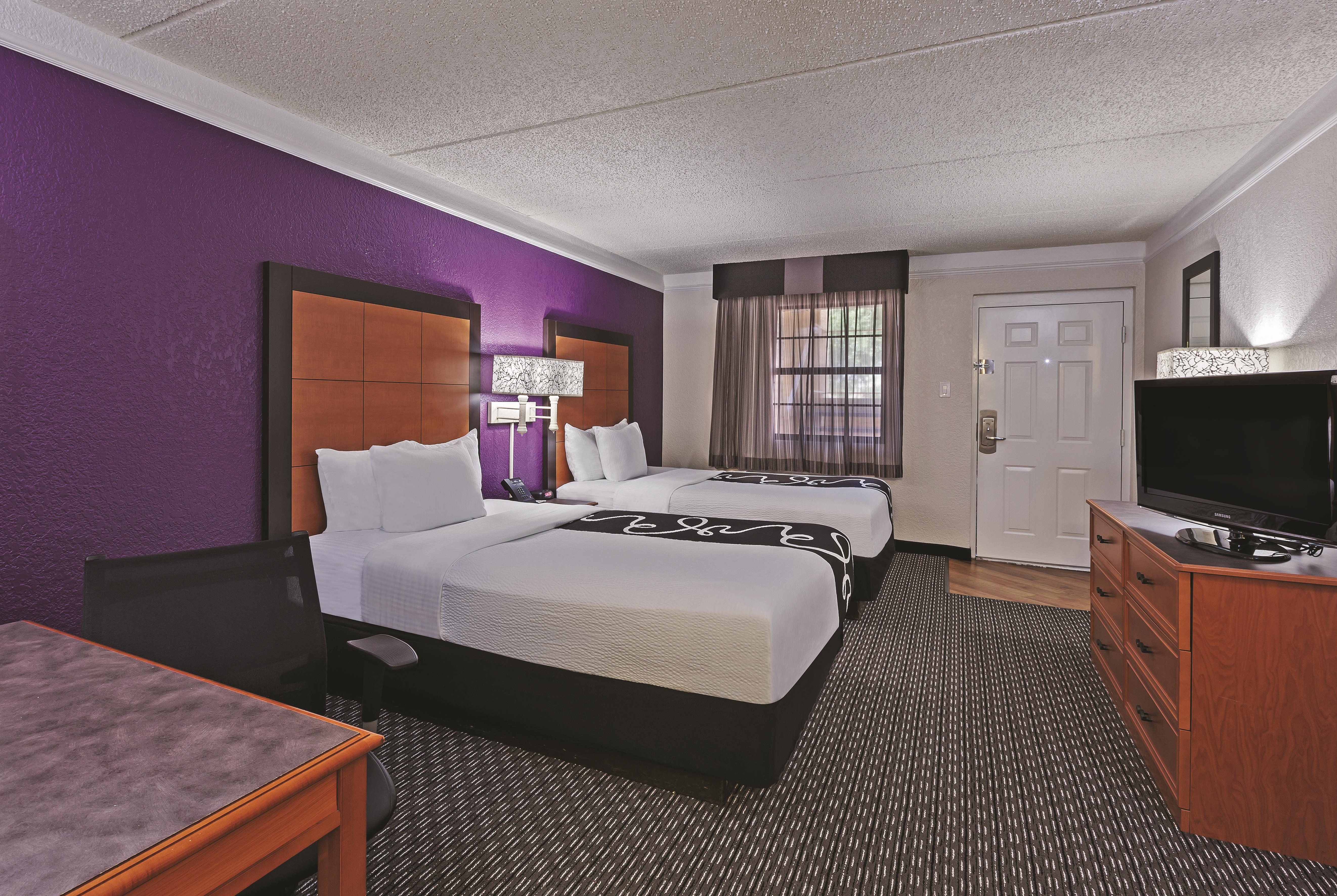 Guest room at the Travelodge by Wyndham Houston Cy-Fair in Houston, Texas