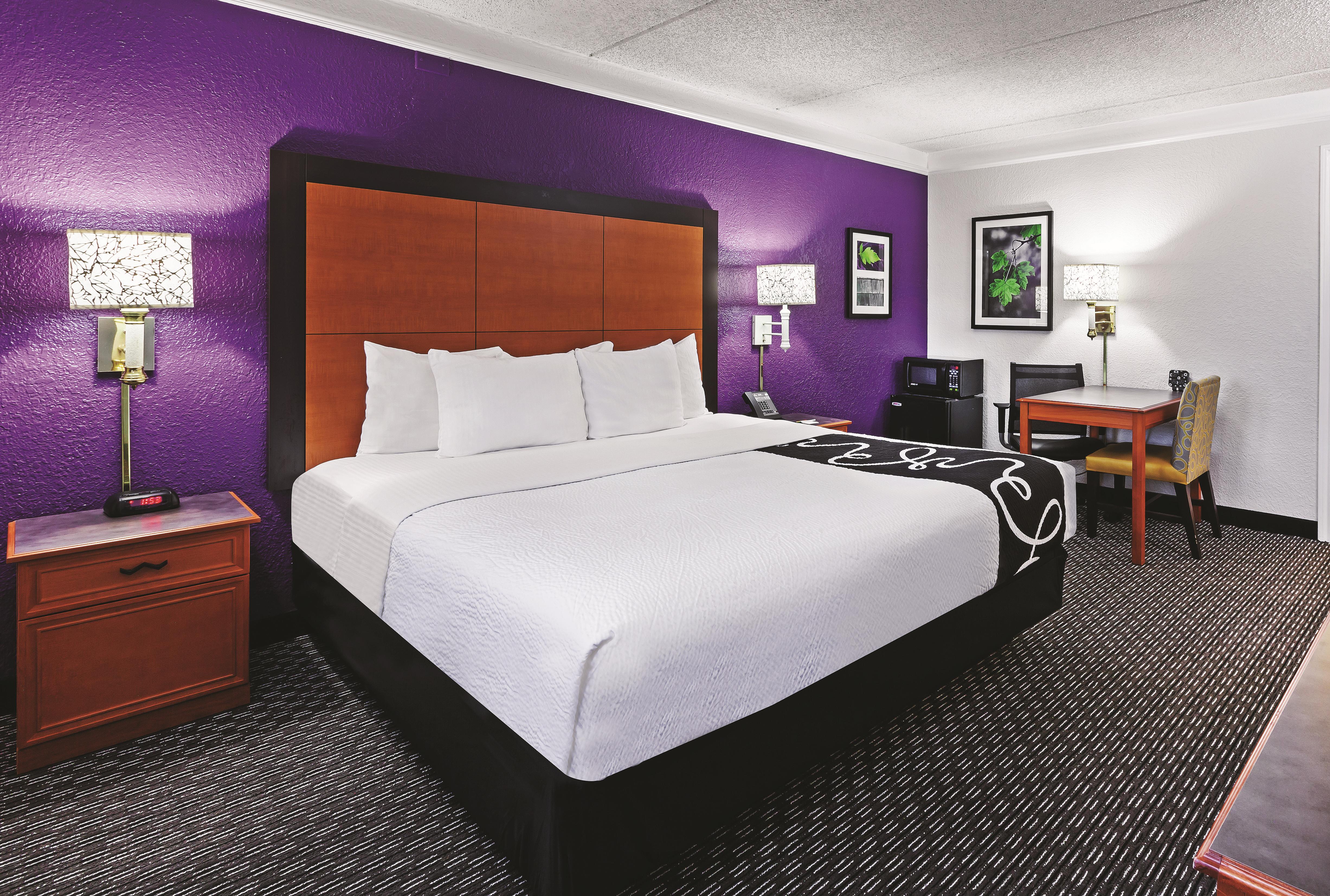Guest room at the Travelodge by Wyndham Houston Cy-Fair in Houston, Texas