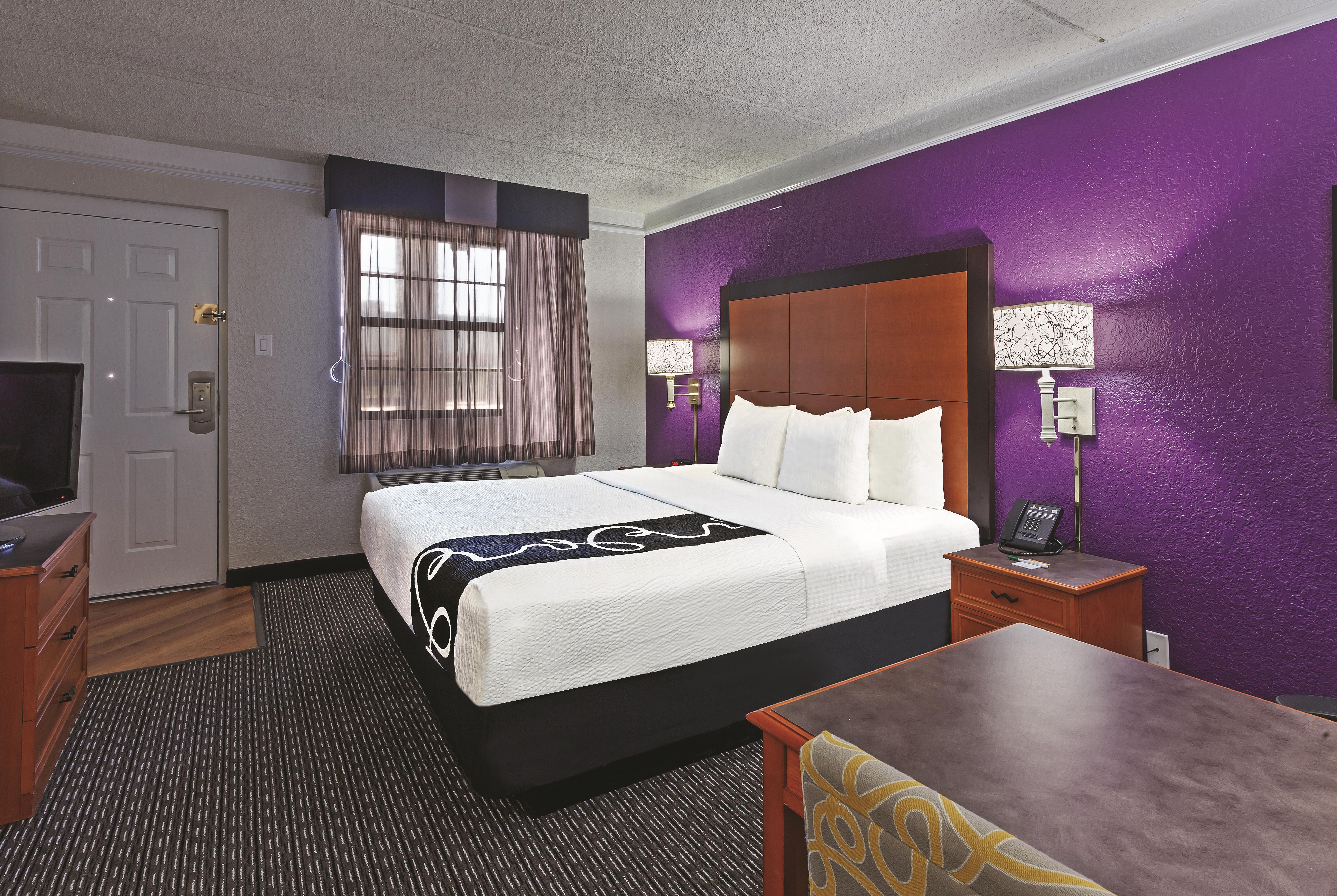 Guest room at the Travelodge by Wyndham Houston Cy-Fair in Houston, Texas