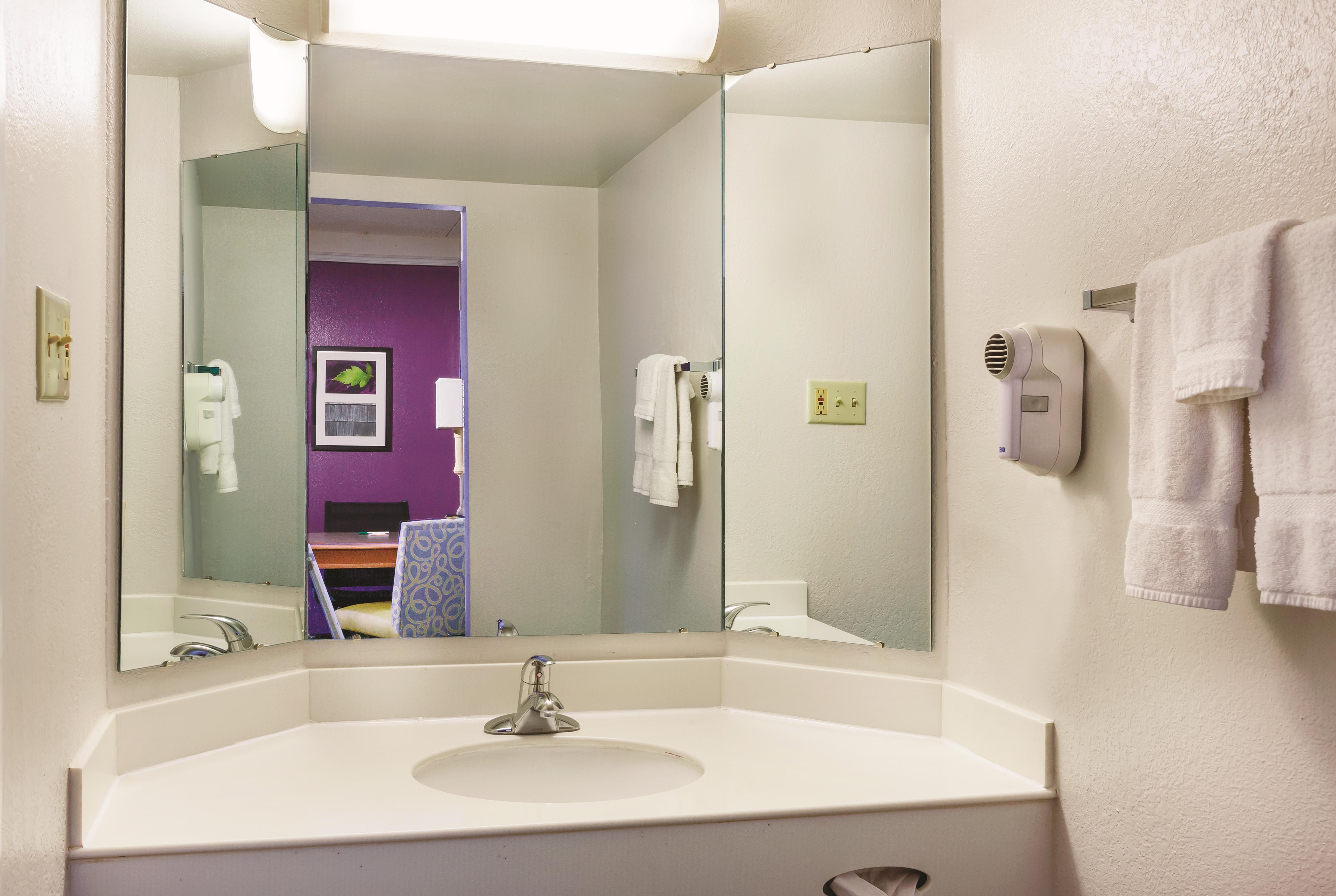 Guest room bath at the Travelodge by Wyndham Houston Cy-Fair in Houston, Texas