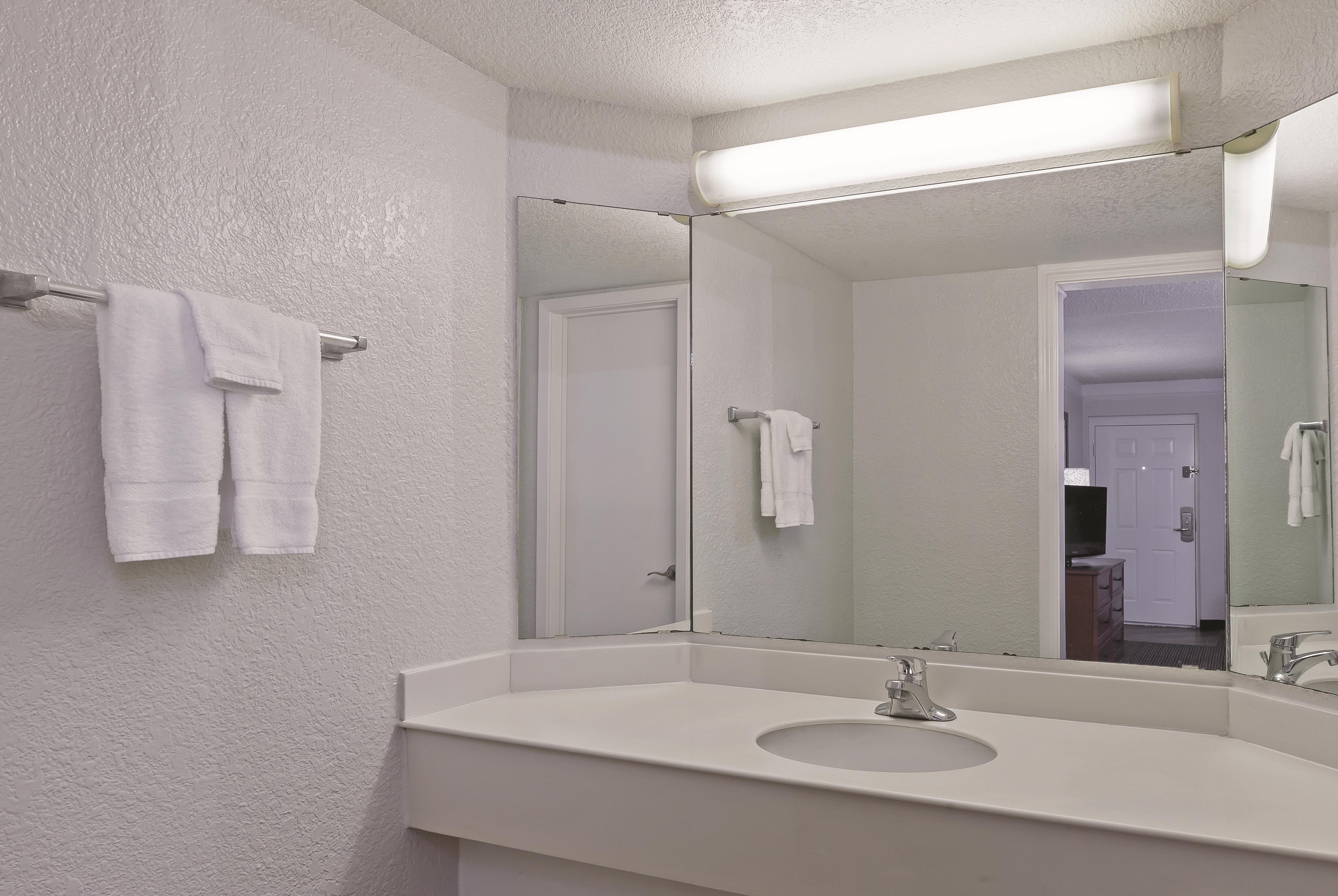Guest room bath at the Travelodge by Wyndham Houston Cy-Fair in Houston, Texas