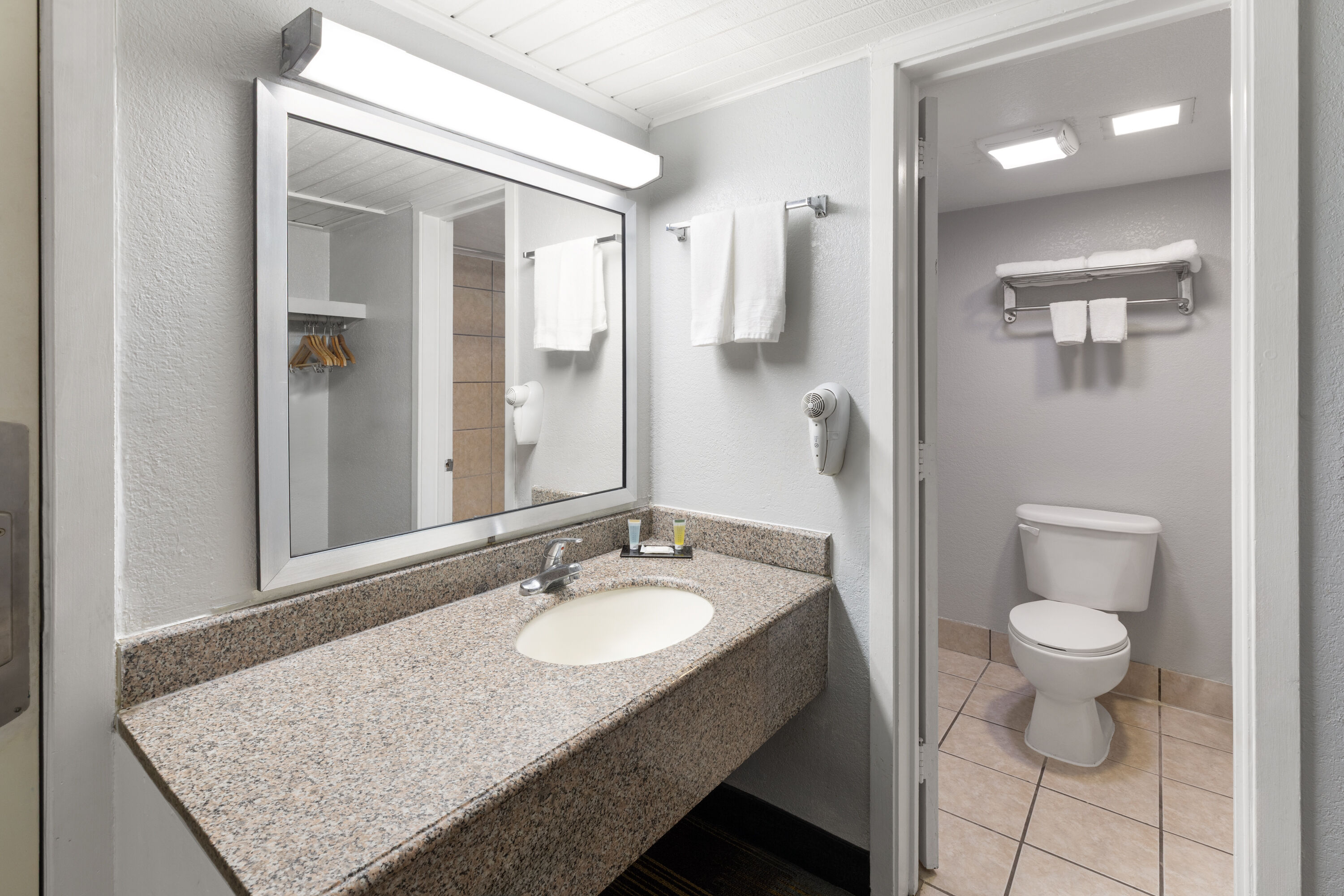 Guest room bath at the Travelodge by Wyndham New Braunfels in New Braunfels, Texas