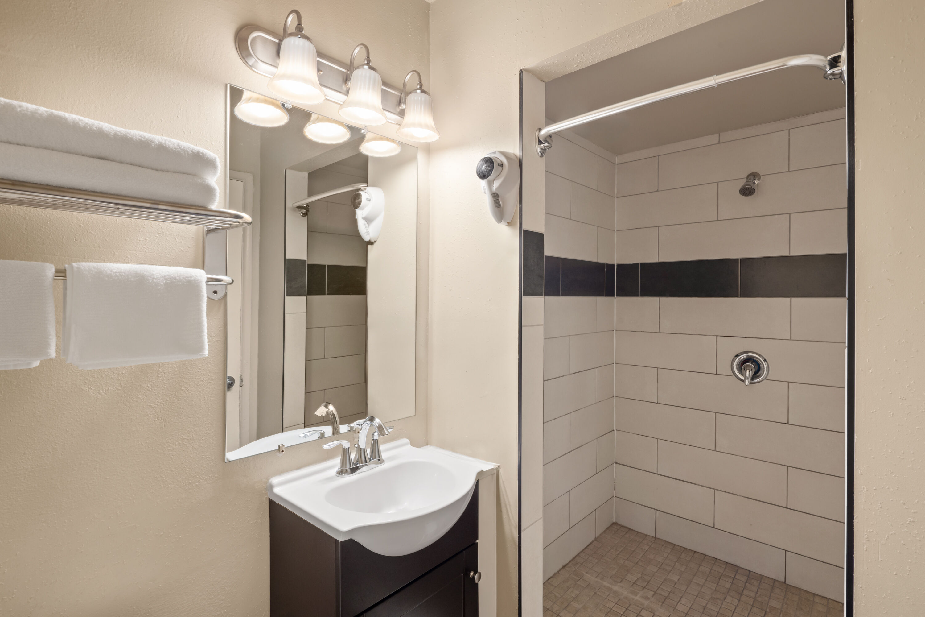 Guest room bath at the Travelodge by Wyndham Everett City Center in Everett, Washington
