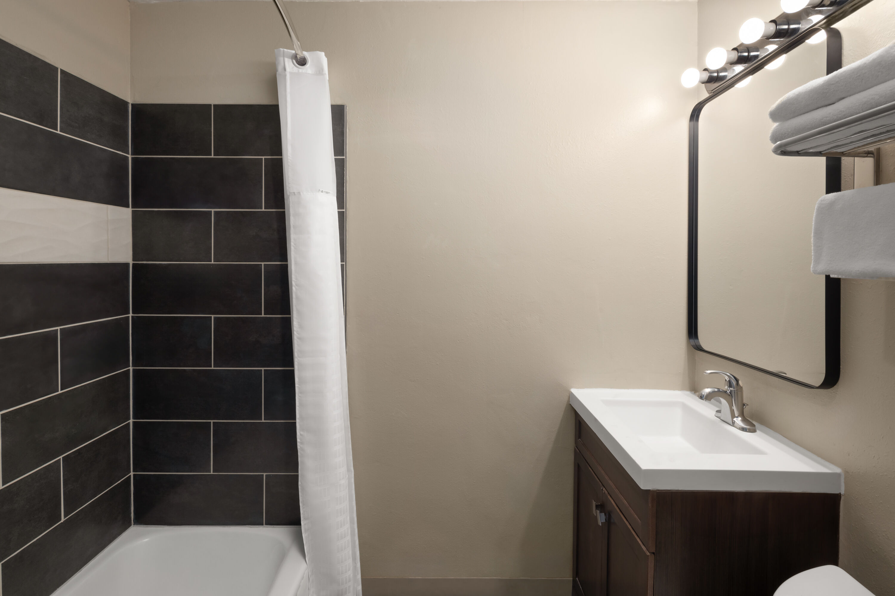 Guest room bath at the Travelodge by Wyndham Everett City Center in Everett, Washington