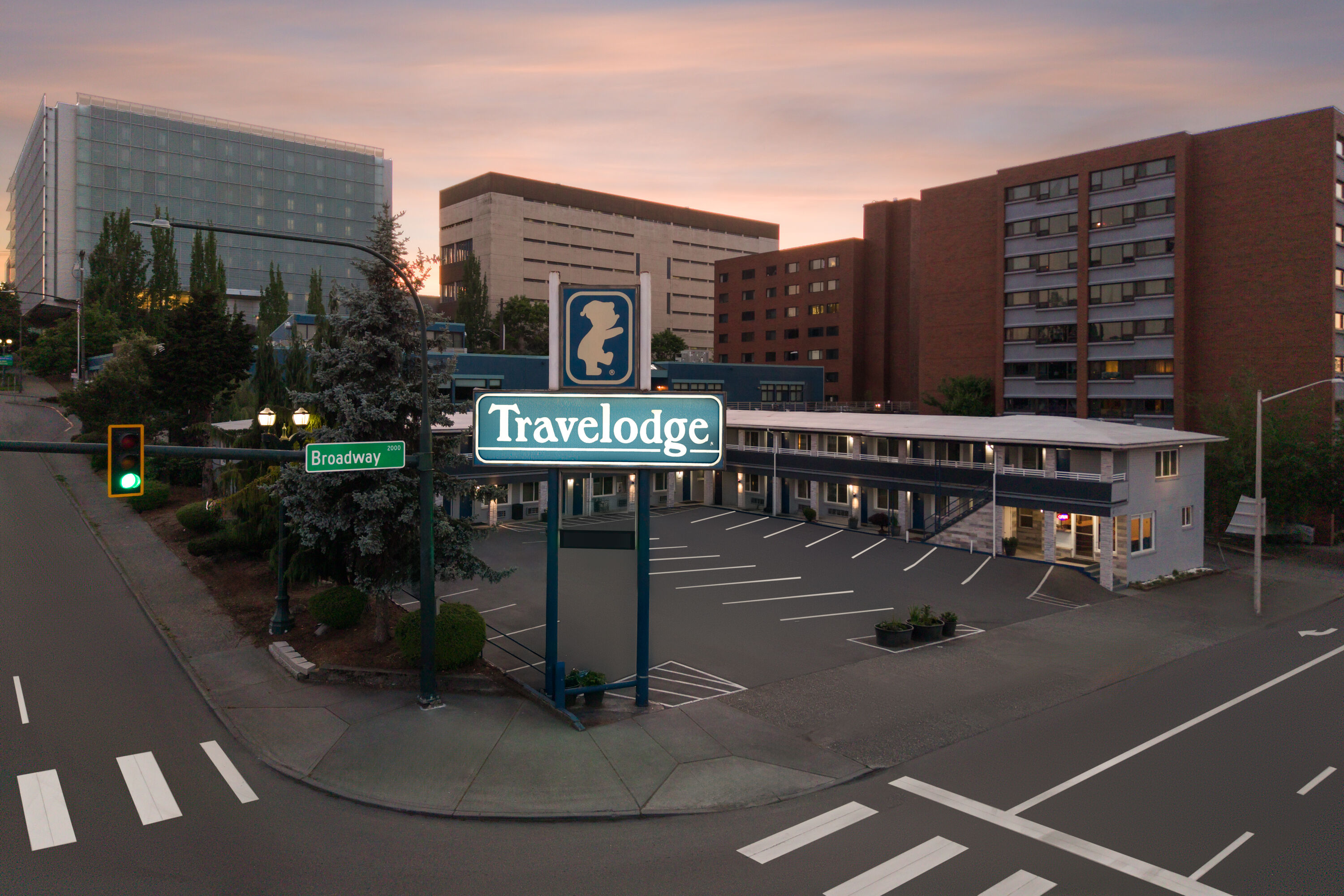 Exterior Dusk Image of Travelodge by Wyndham Everett City Center hotel in Everett, Washington