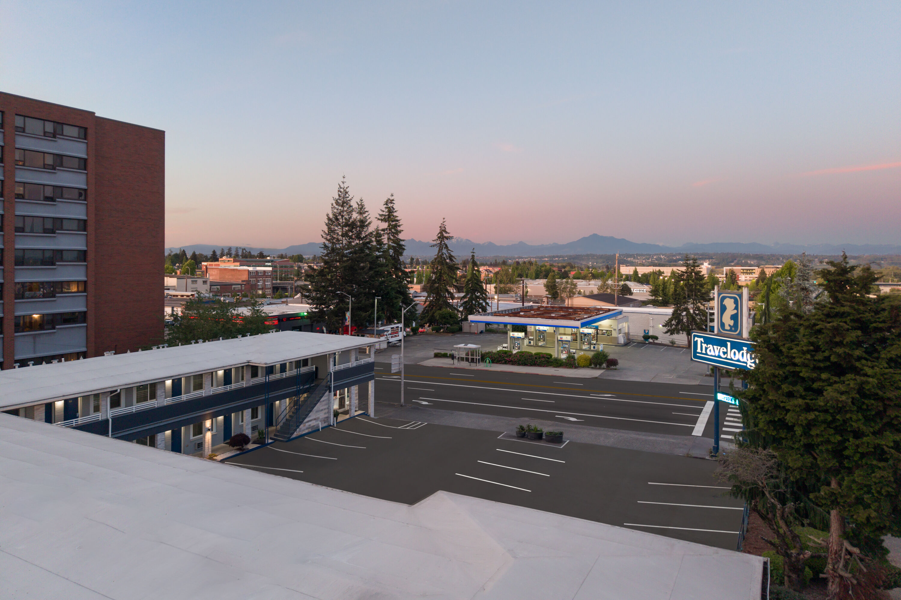 Exterior Dusk Image of Travelodge by Wyndham Everett City Center hotel in Everett, Washington