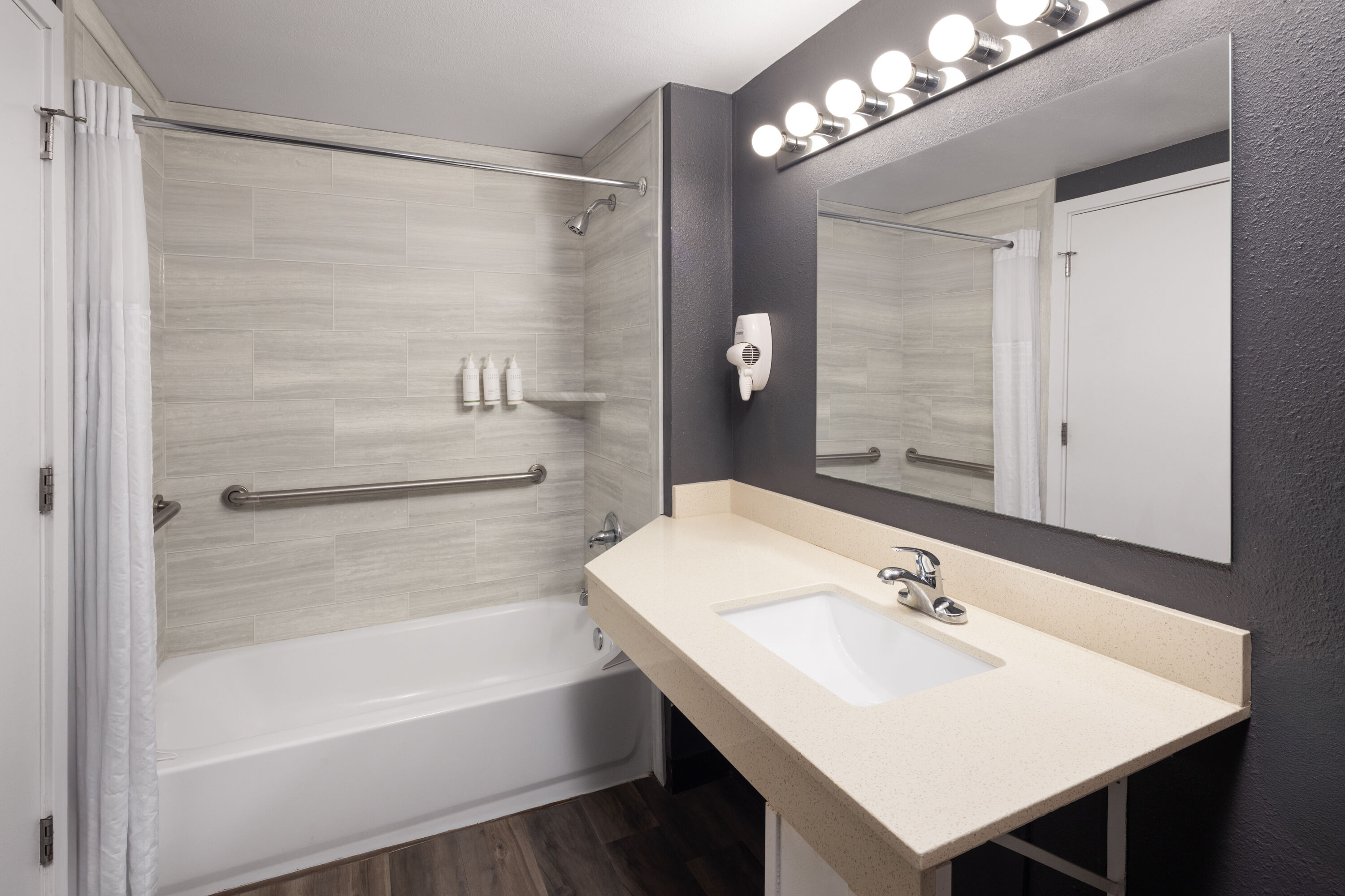 Guest room bath at the Basecamp Puyallup a Travelodge by Wyndham in Puyallup, Washington