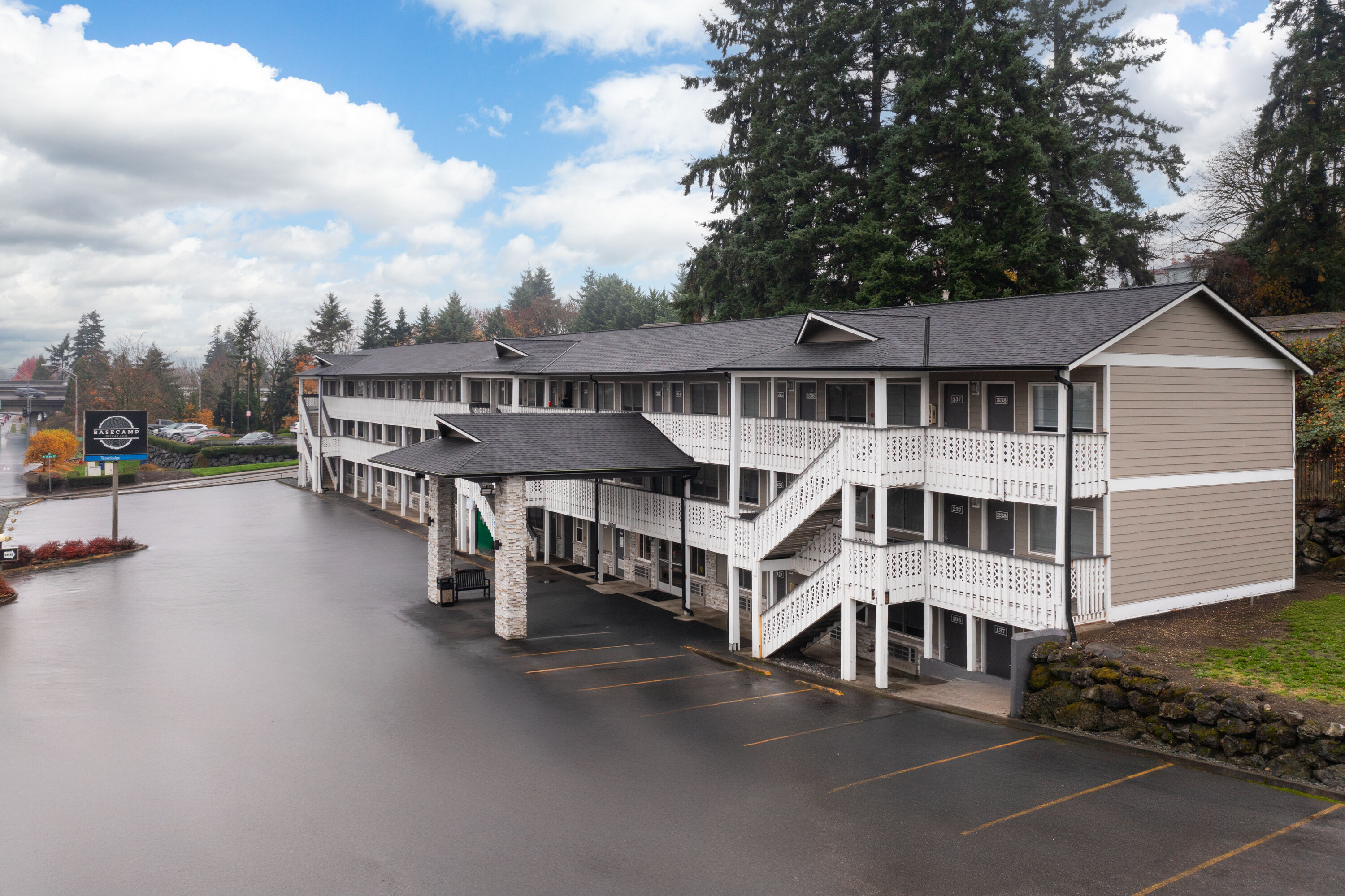 Exterior Day Image of Basecamp Puyallup a Travelodge by Wyndham hotel in Puyallup, Washington