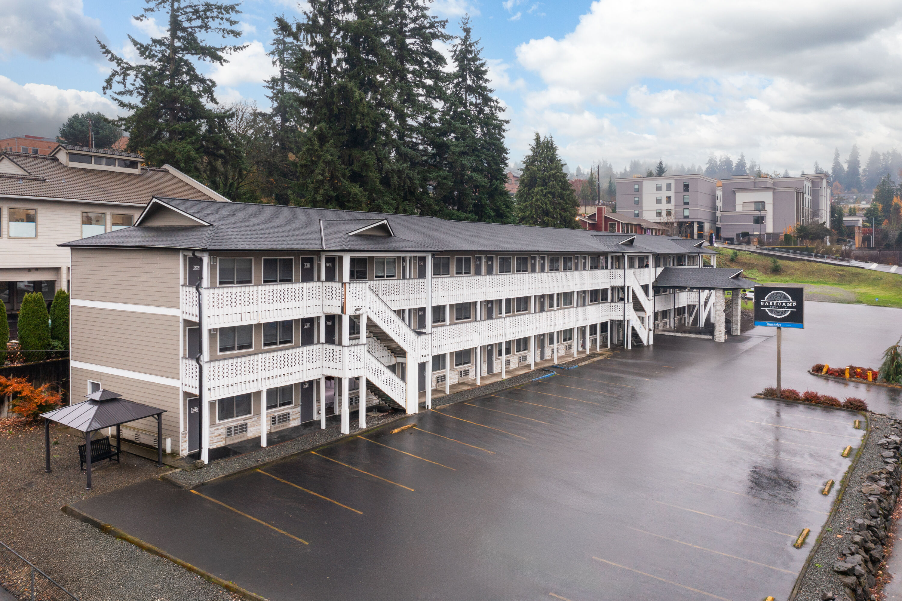 Exterior Day Image of Basecamp Puyallup a Travelodge by Wyndham hotel in Puyallup, Washington