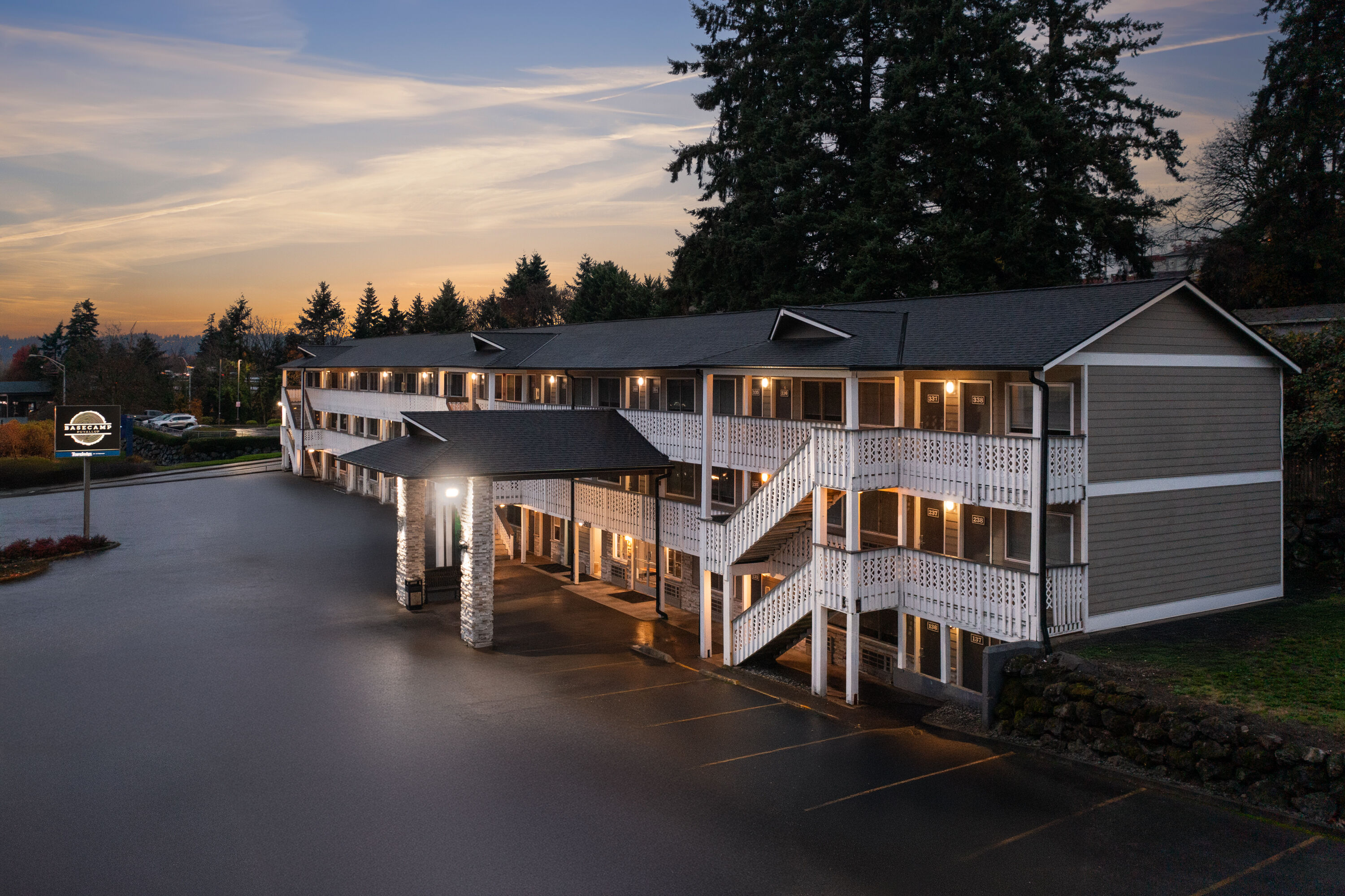 Exterior Dusk Image of Basecamp Puyallup a Travelodge by Wyndham hotel in Puyallup, Washington