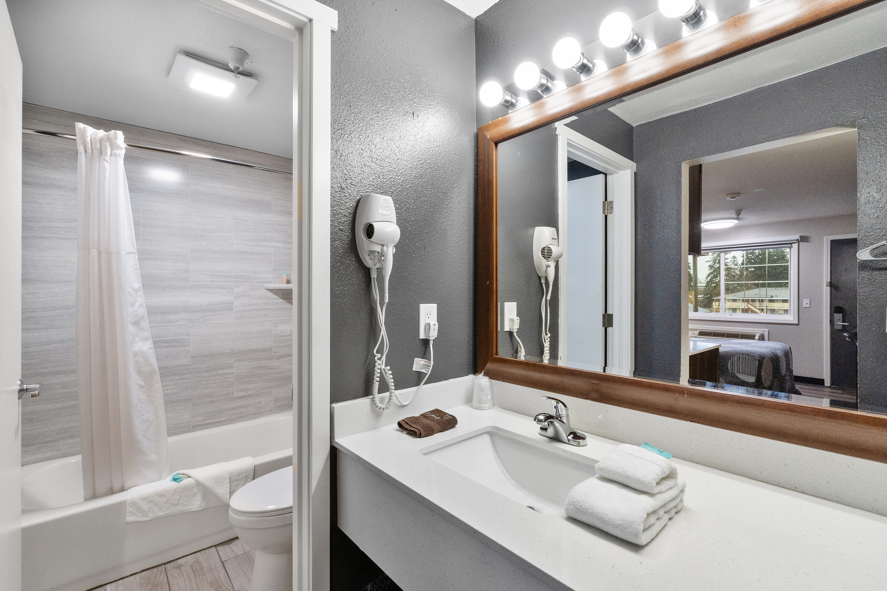 Guest room bath at the Basecamp Puyallup a Travelodge by Wyndham in Puyallup, Washington