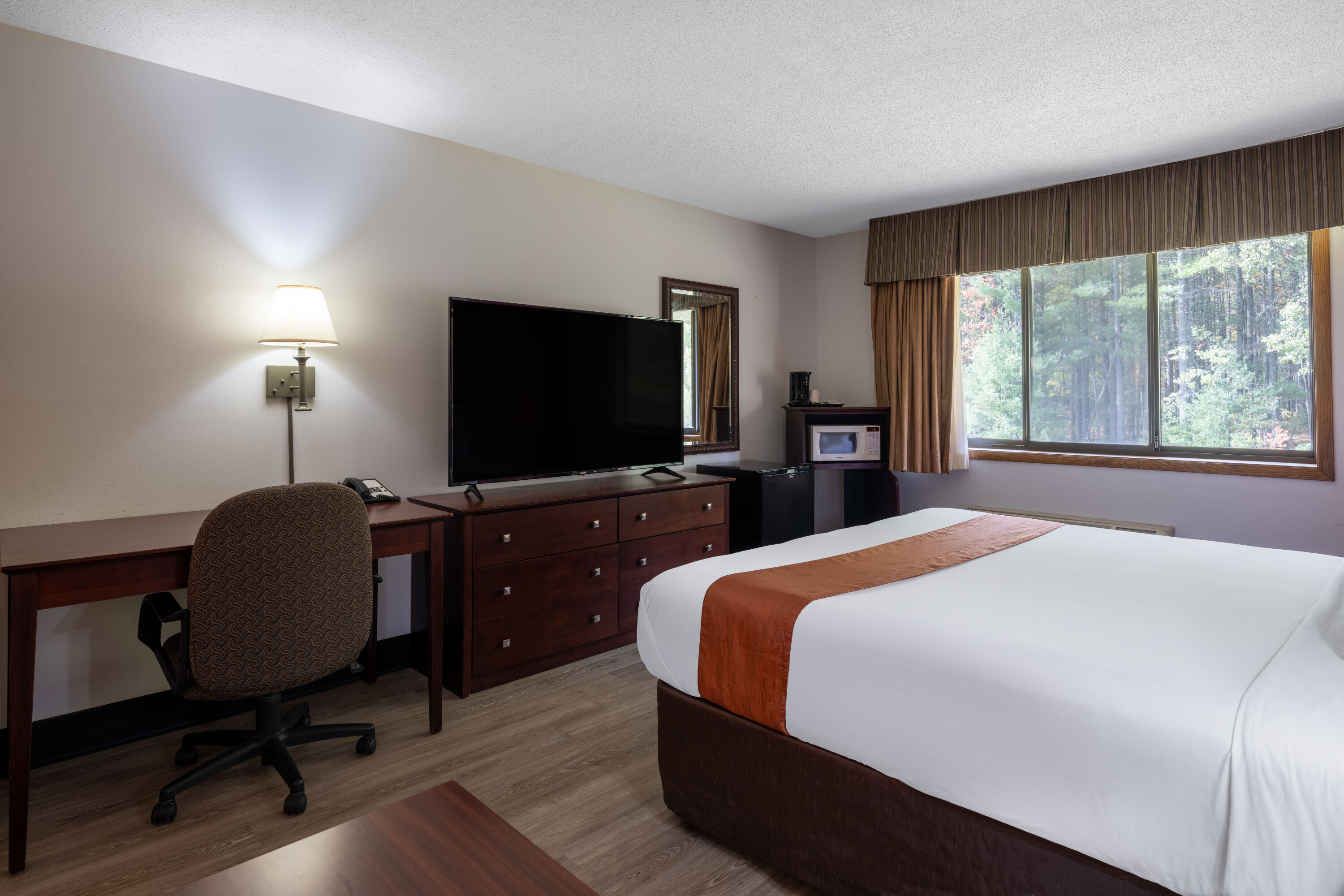 Guest room at the Travelodge by Wyndham Merrill in Merrill, Wisconsin