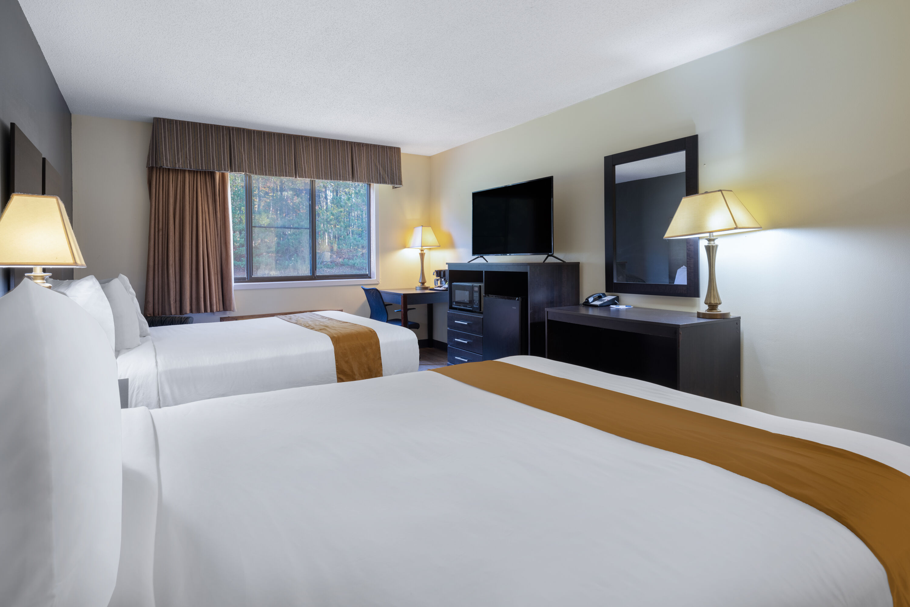 Guest room at the Travelodge by Wyndham Merrill in Merrill, Wisconsin
