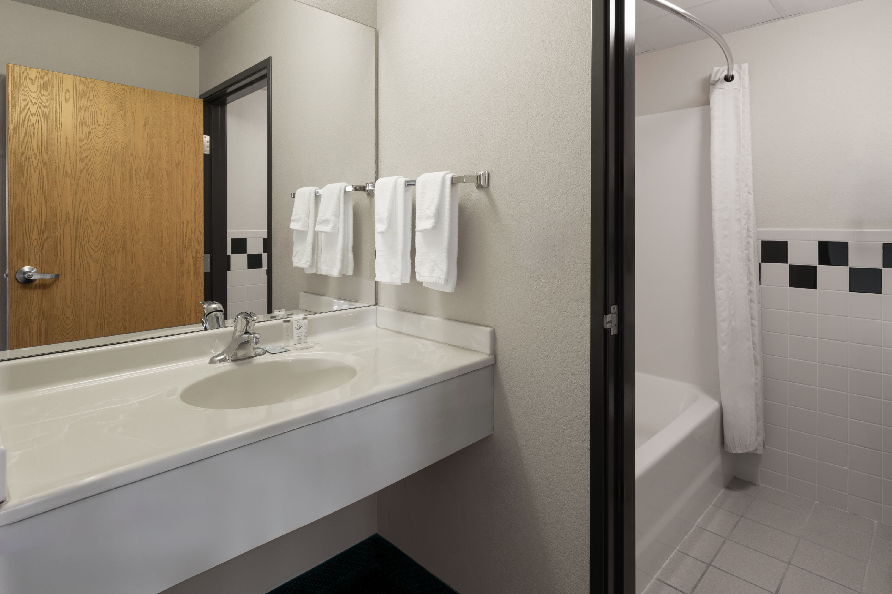 Guest room bath at the Shell Lake Lodge, a Travelodge by Wyndham in Shell Lake, Wisconsin
