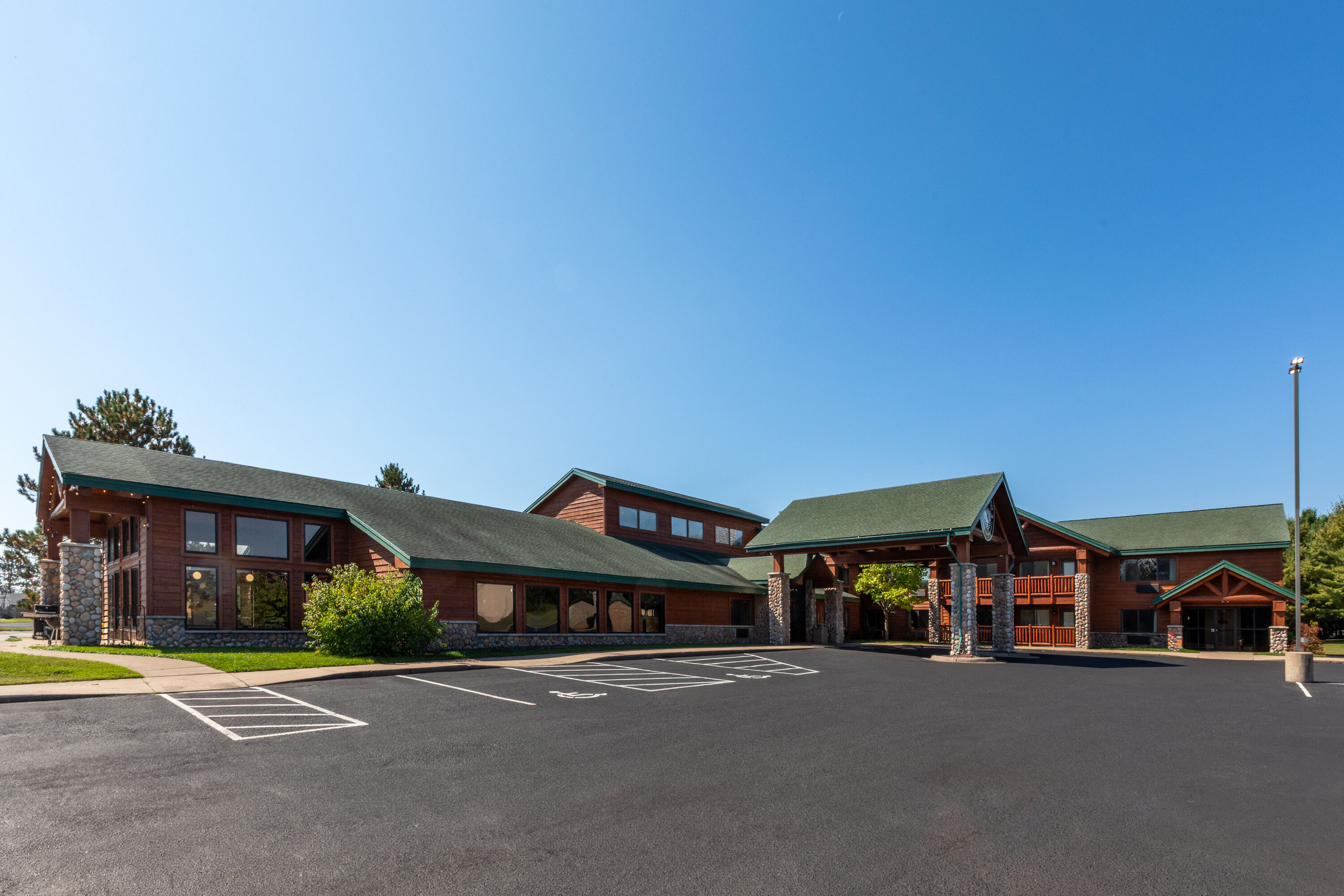 Exterior Day Image of Shell Lake Lodge, a Travelodge by Wyndham hotel in Shell Lake, Wisconsin