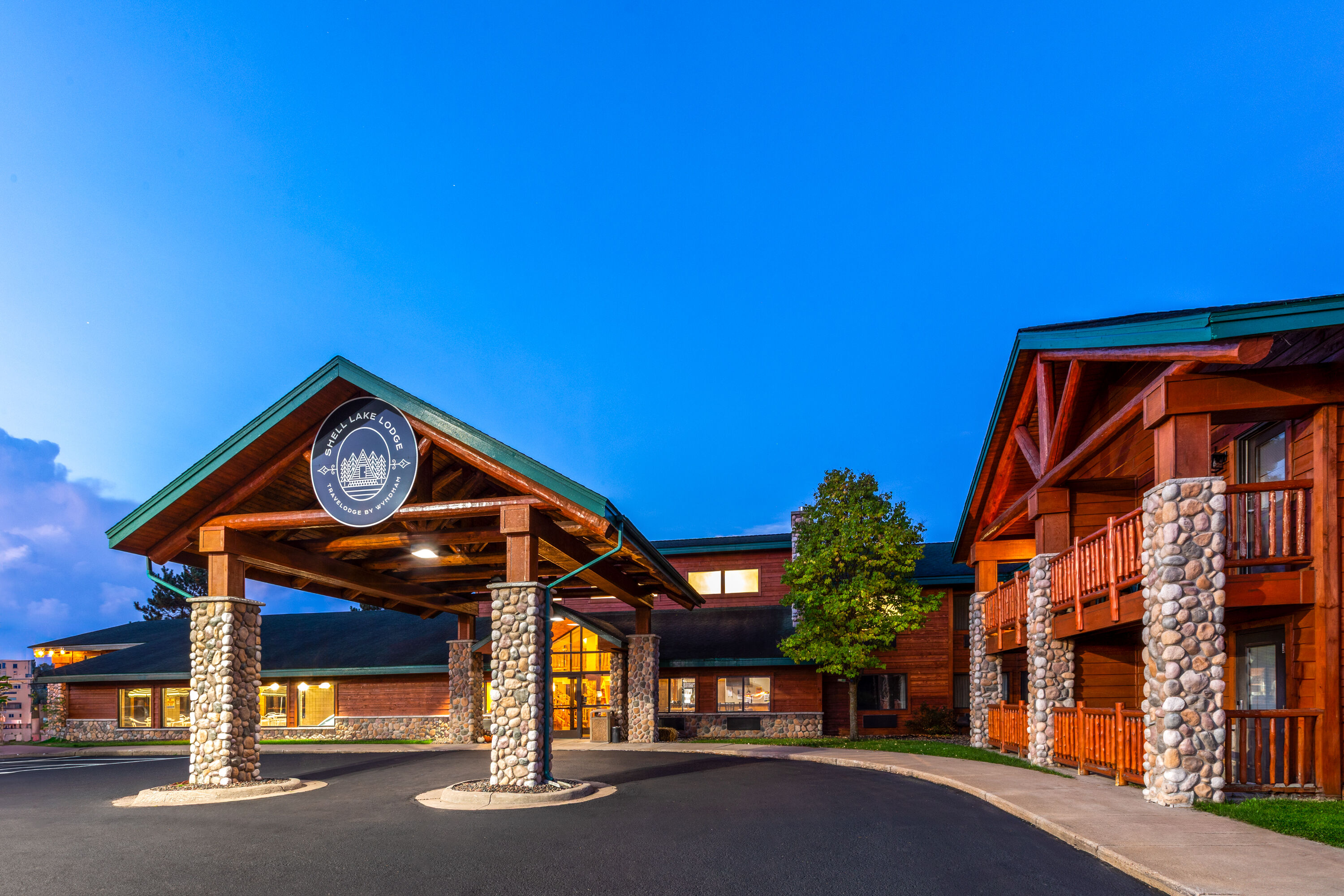 Exterior Dusk Image of Shell Lake Lodge, a Travelodge by Wyndham hotel in Shell Lake, Wisconsin