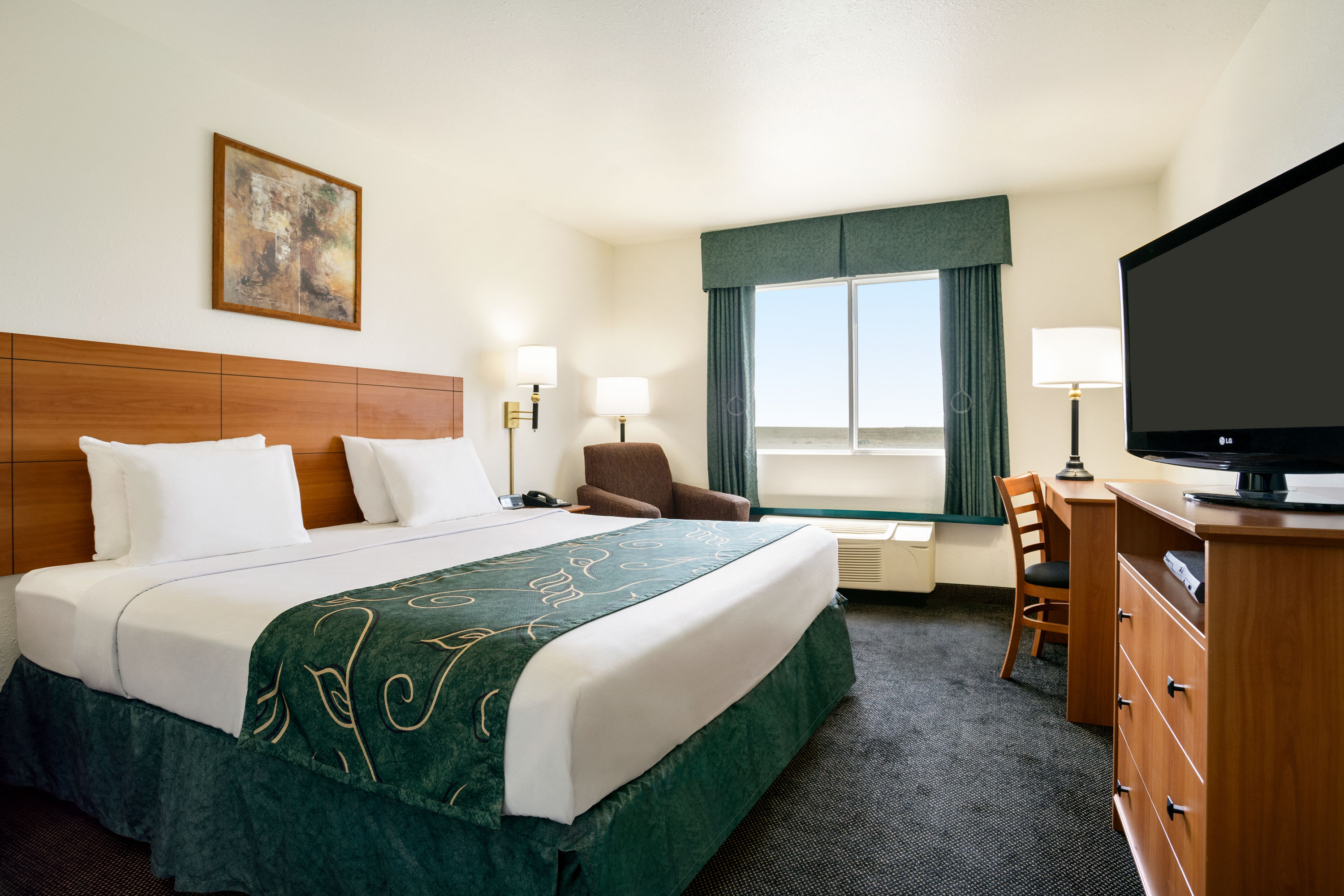 Guest room at the Travelodge by Wyndham Bill WY Thunder Basin Ntl Grassland in Douglas, Wyoming