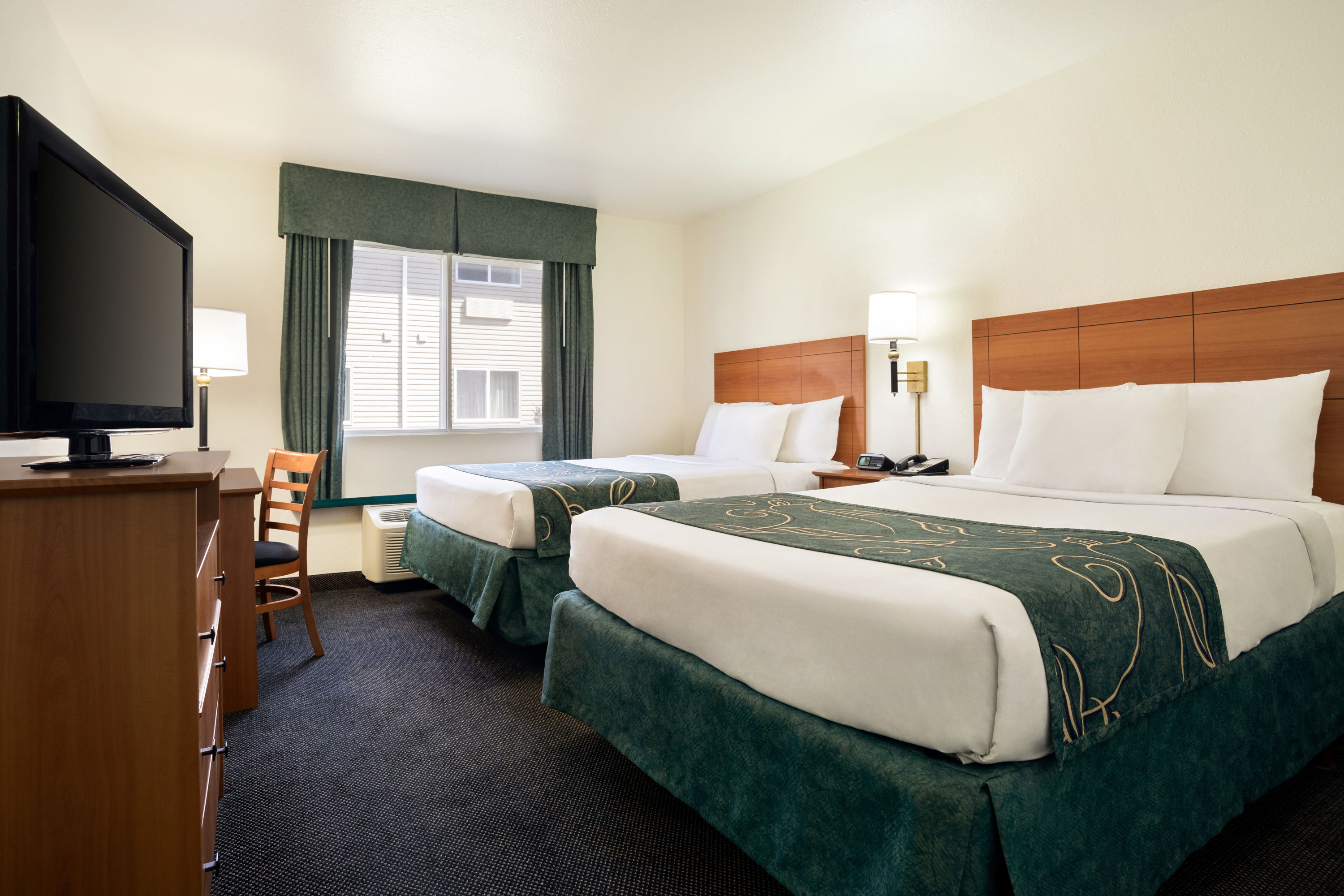 Guest room at the Travelodge by Wyndham Bill WY Thunder Basin Ntl Grassland in Douglas, Wyoming