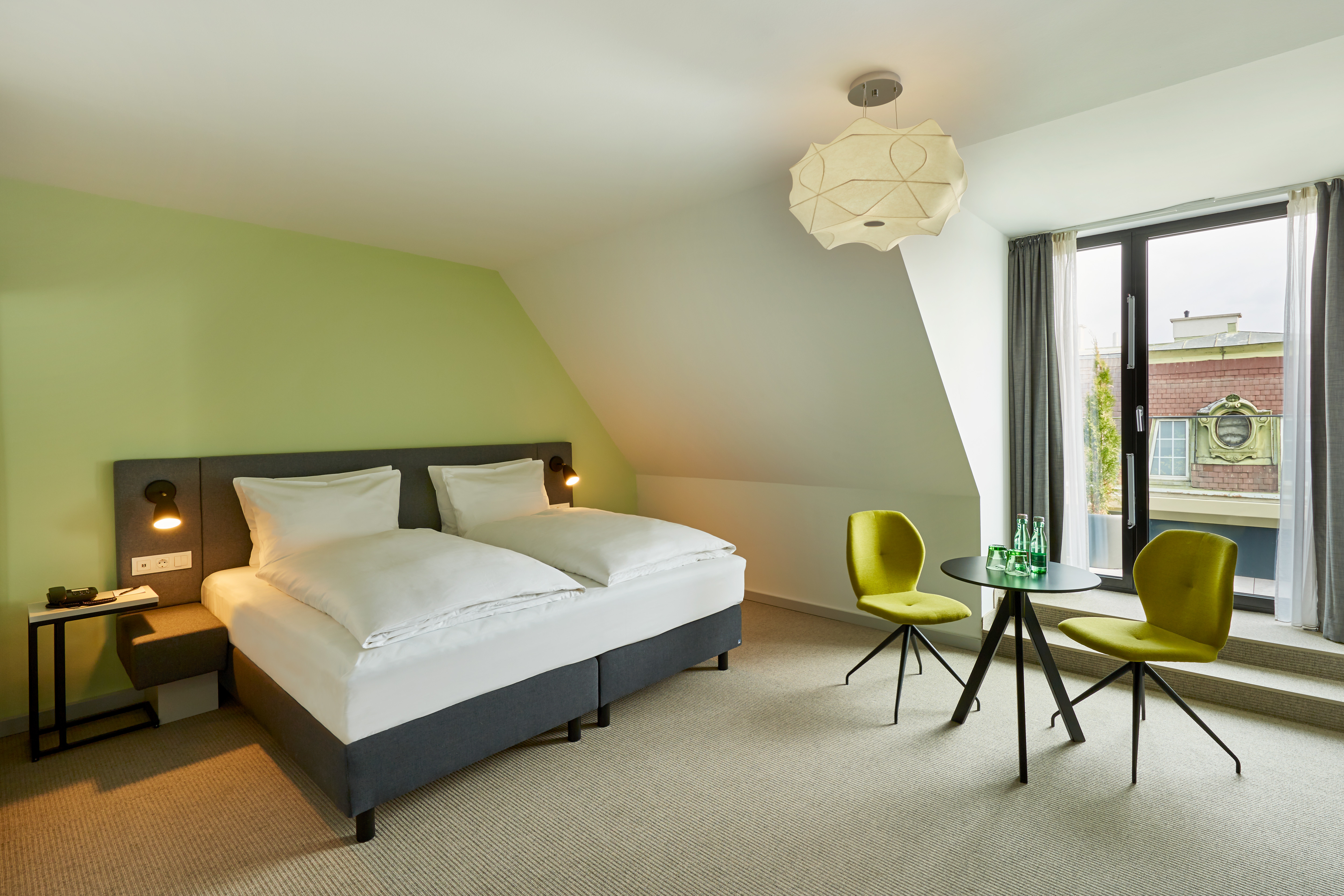 Guest room at the H+ Hotel Wien in Vienna, Other than US/Canada