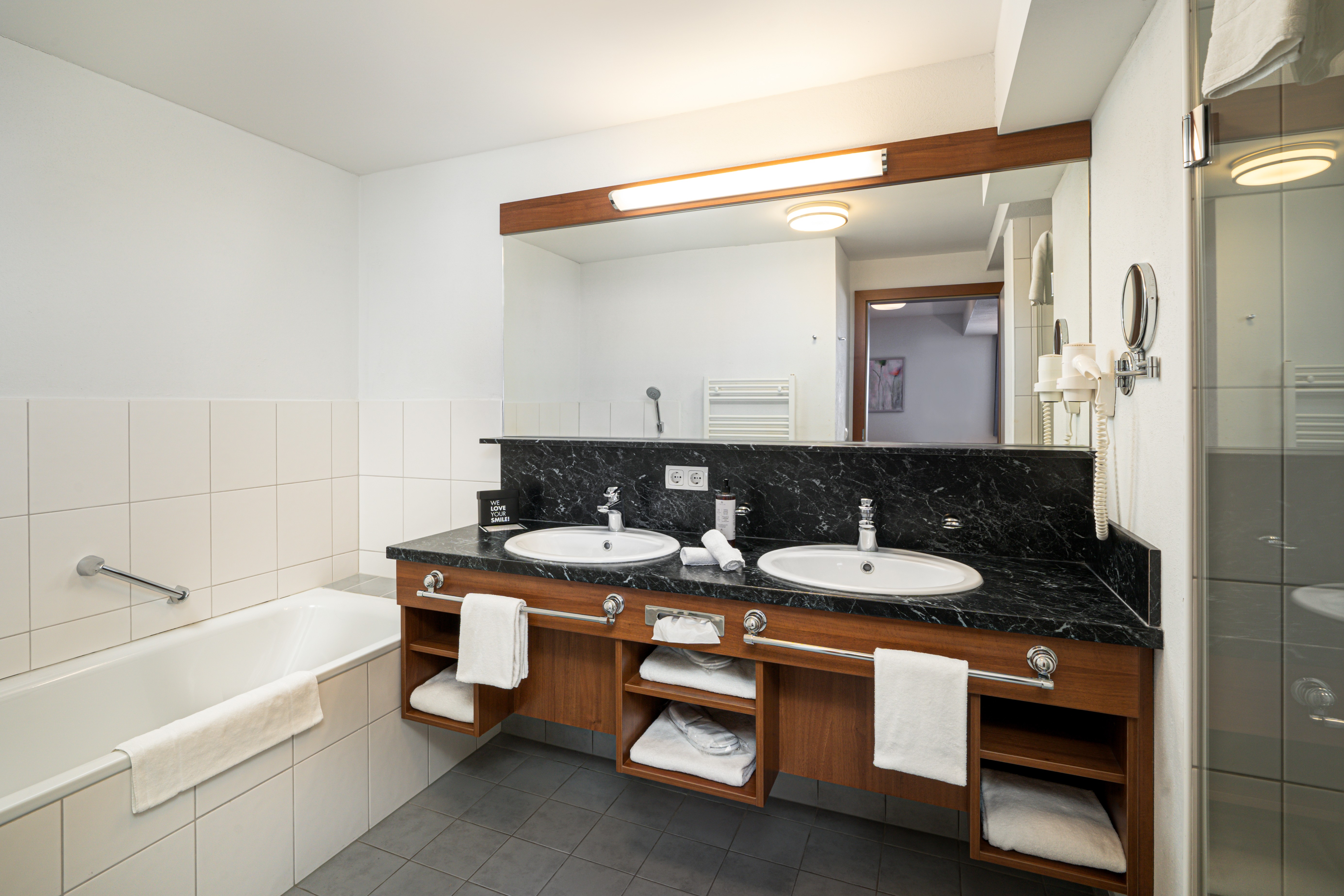 Guest room bath at the KUHOTEL Steinplatte, Trademark Collection by Wyndham in Waidring, Other than US/Canada