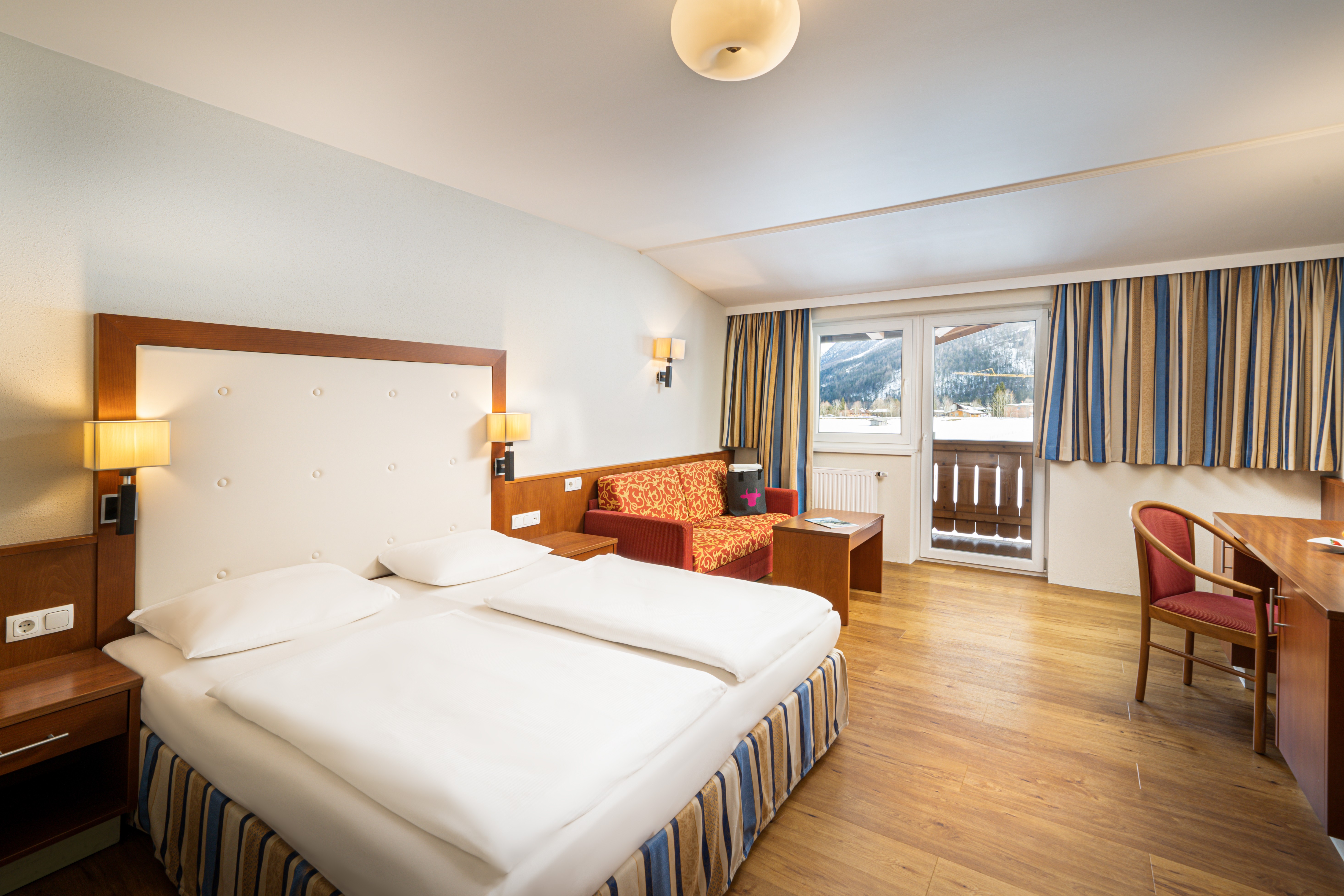 Guest room at the KUHOTEL Steinplatte, Trademark Collection by Wyndham in Waidring, Other than US/Canada