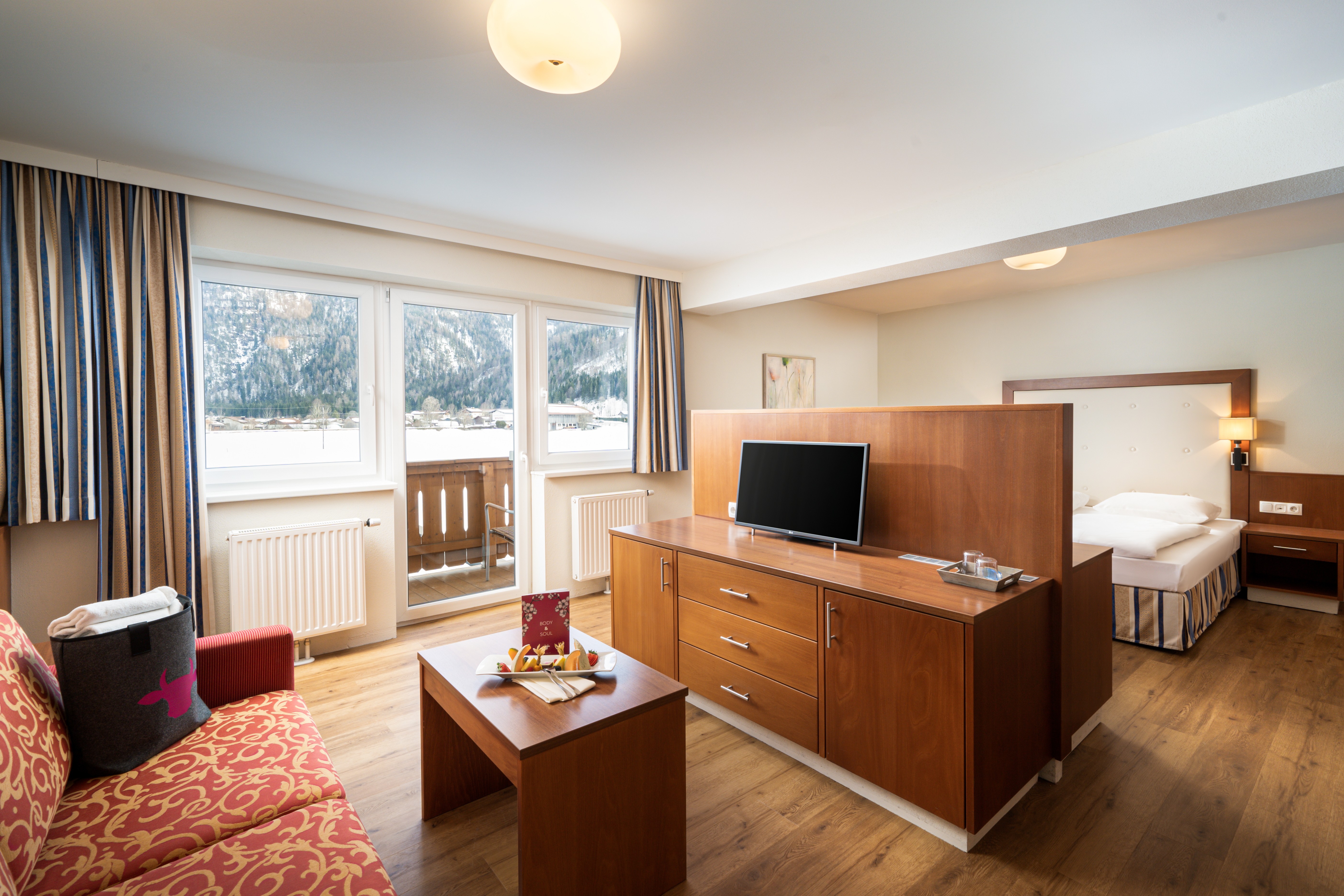 Guest room at the KUHOTEL Steinplatte, Trademark Collection by Wyndham in Waidring, Other than US/Canada