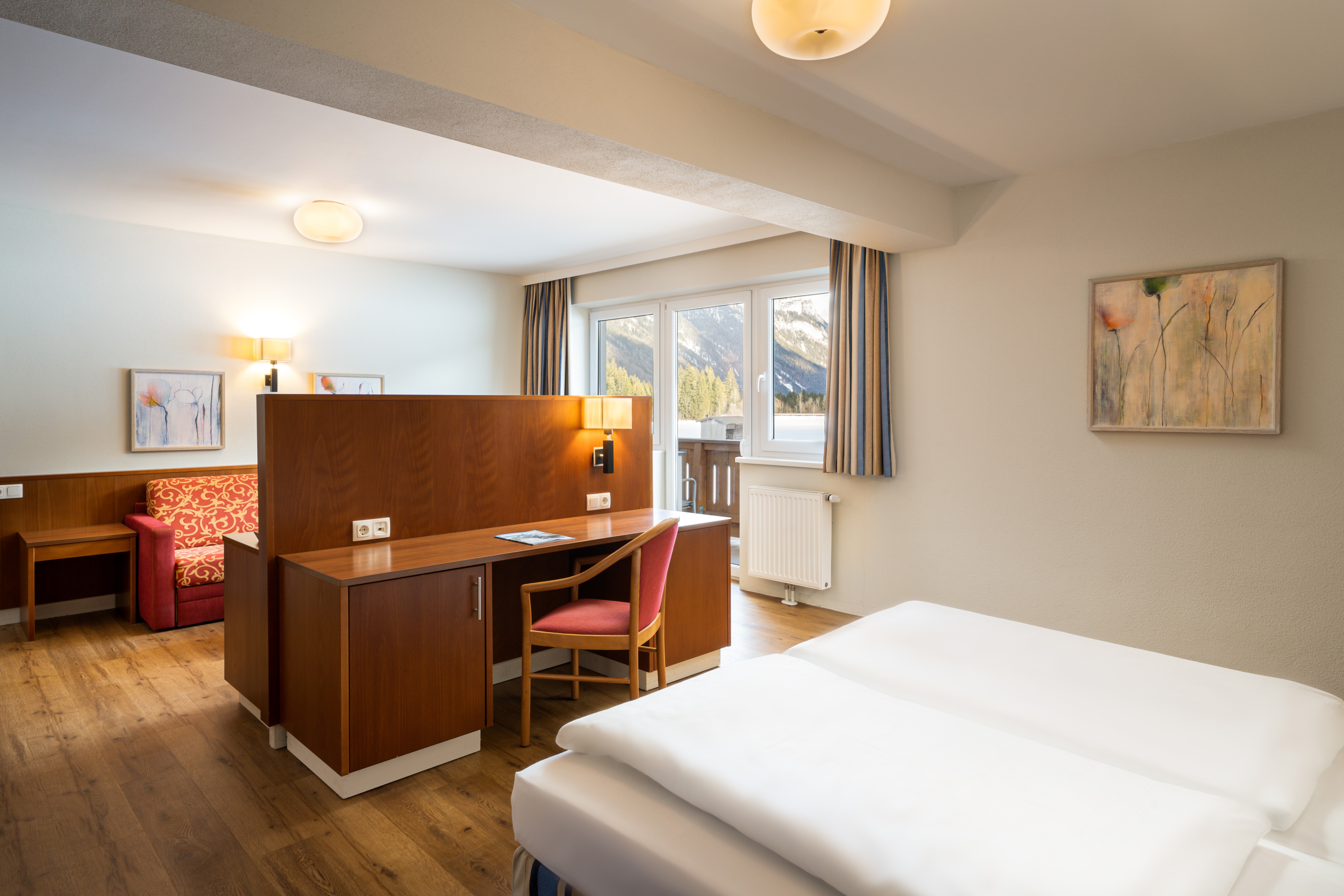 Guest room at the KUHOTEL Steinplatte, Trademark Collection by Wyndham in Waidring, Other than US/Canada
