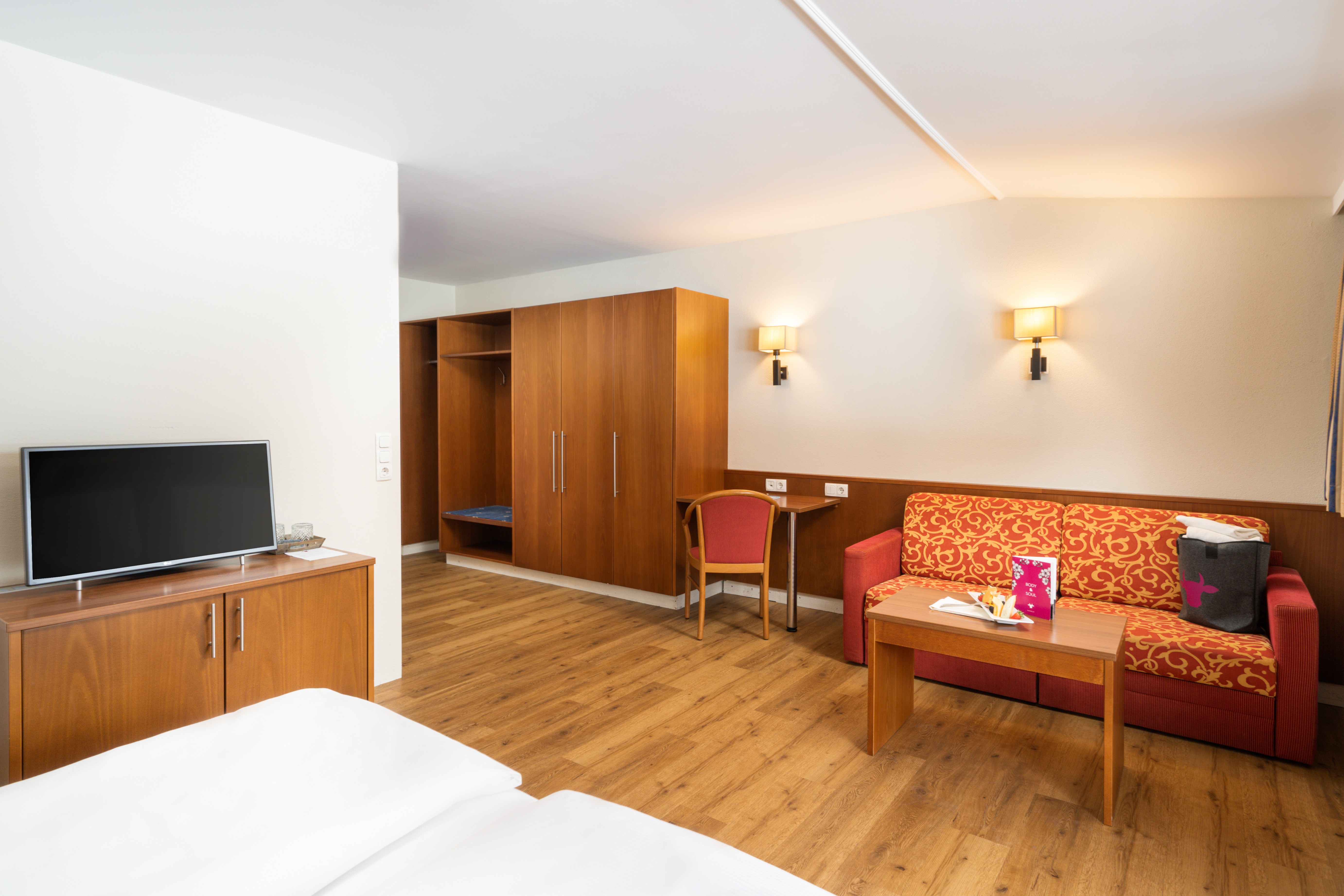 Guest room at the KUHOTEL Steinplatte, Trademark Collection by Wyndham in Waidring, Other than US/Canada