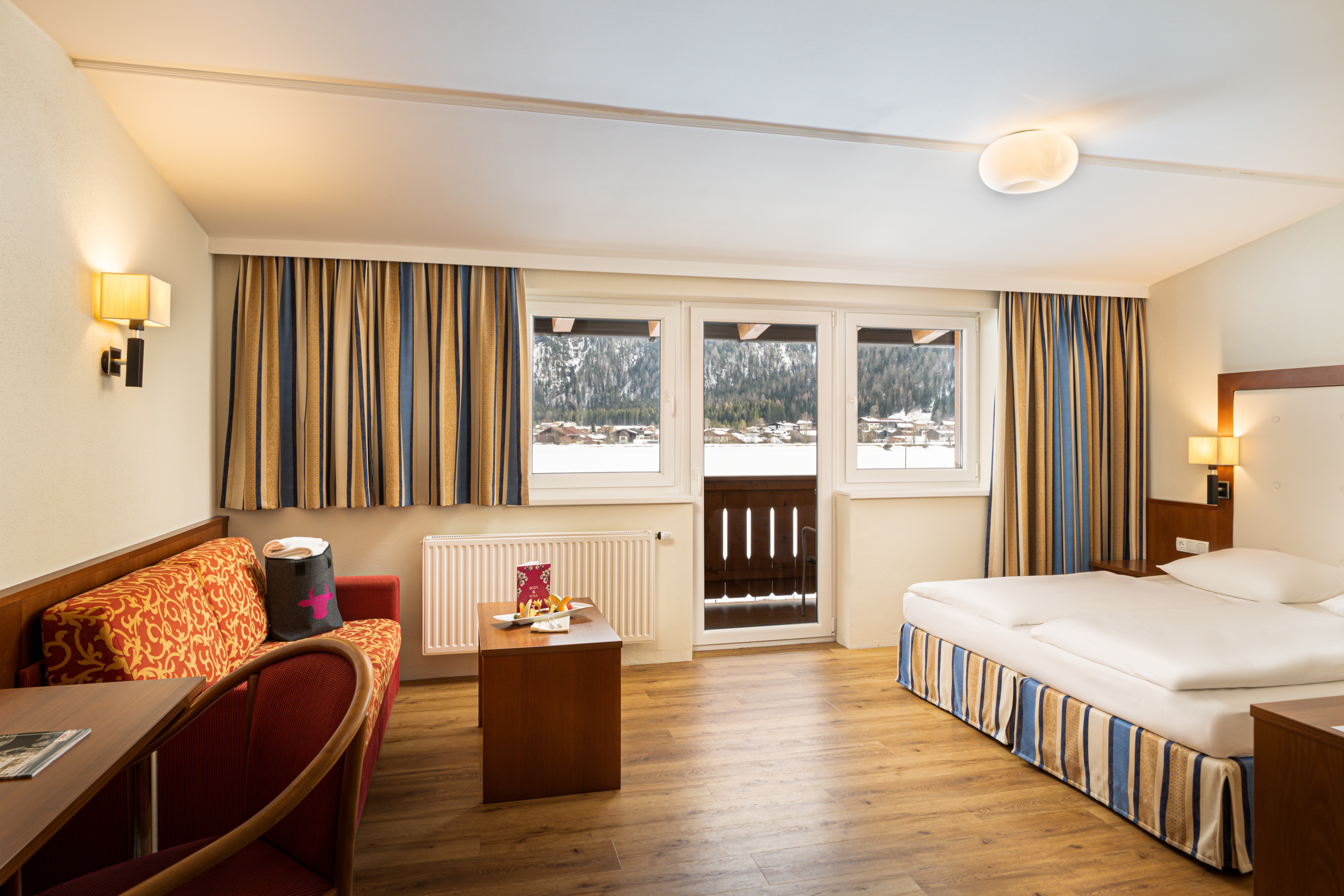 Guest room at the KUHOTEL Steinplatte, Trademark Collection by Wyndham in Waidring, Other than US/Canada