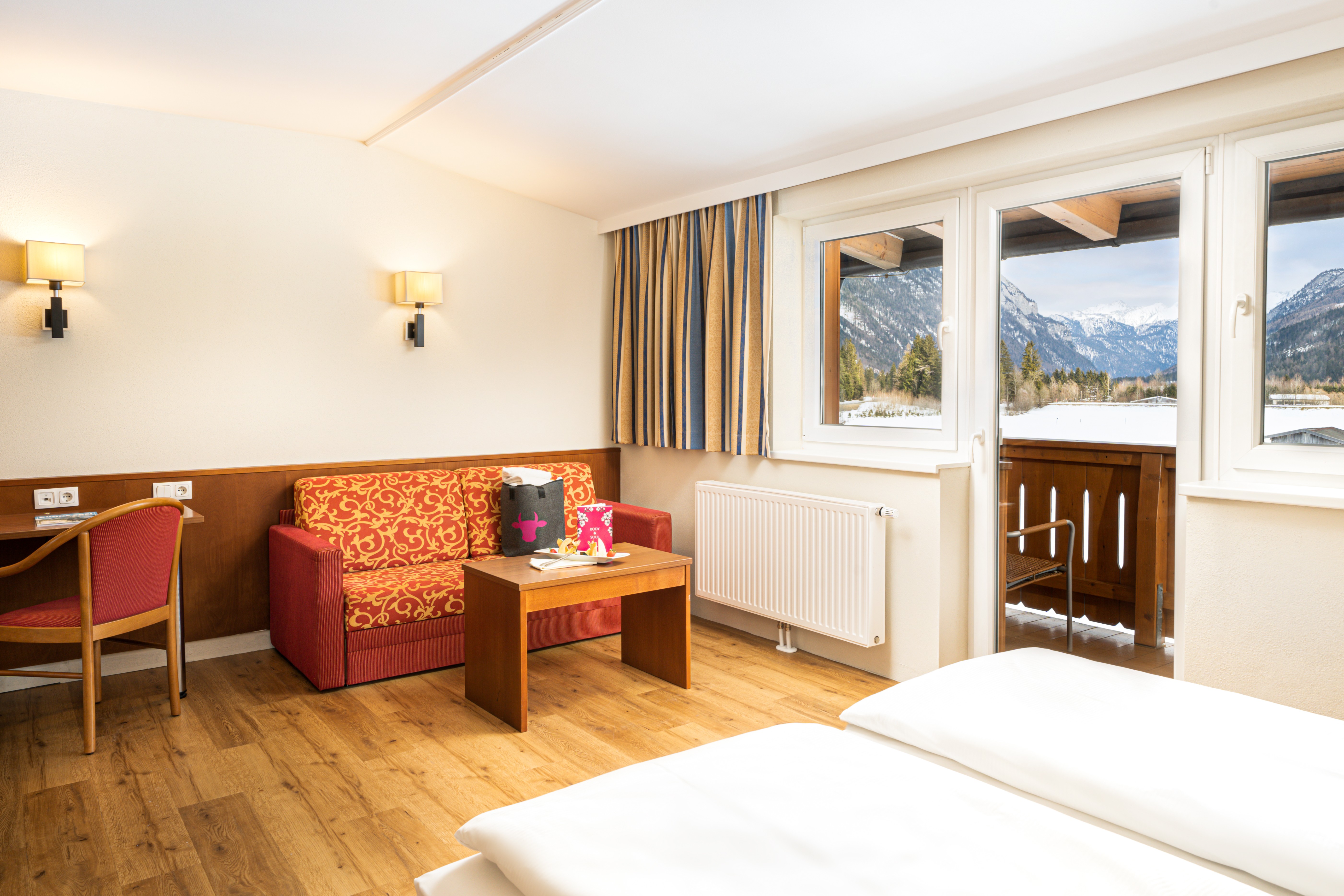 Guest room at the KUHOTEL Steinplatte, Trademark Collection by Wyndham in Waidring, Other than US/Canada