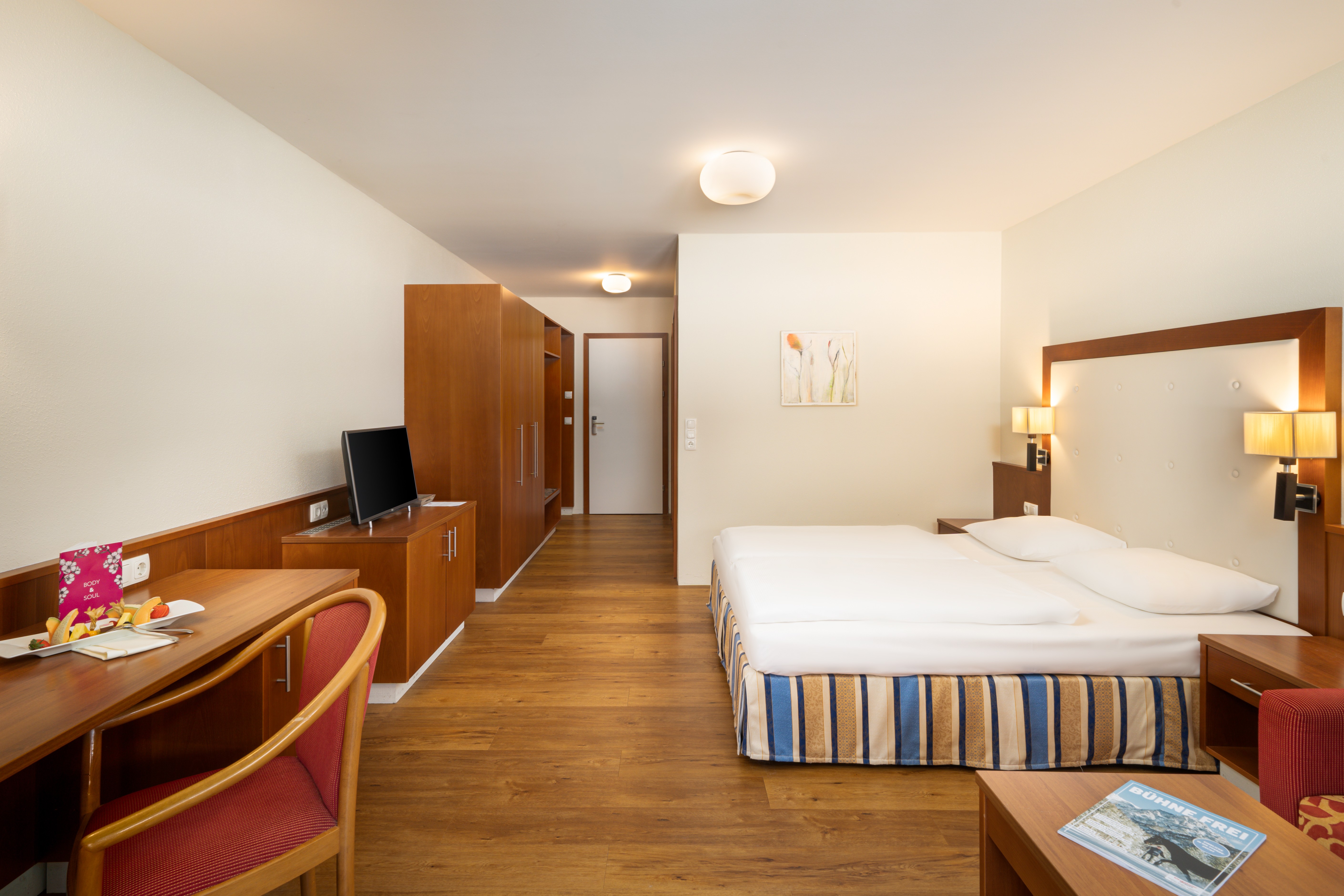 Guest room at the KUHOTEL Steinplatte, Trademark Collection by Wyndham in Waidring, Other than US/Canada