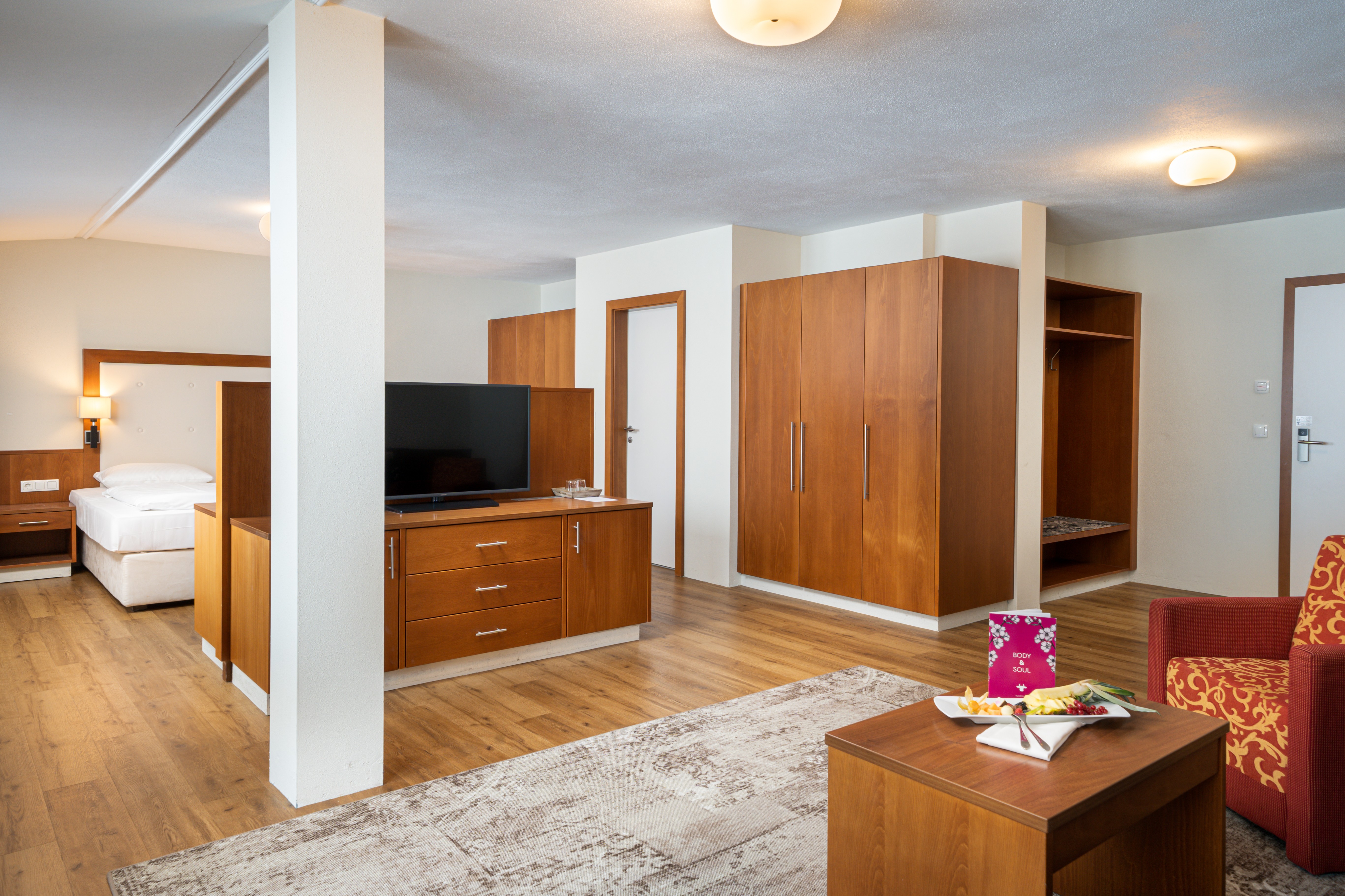 KUHOTEL Steinplatte, Trademark Collection by Wyndham suite living room in Waidring, Other than US/Canada