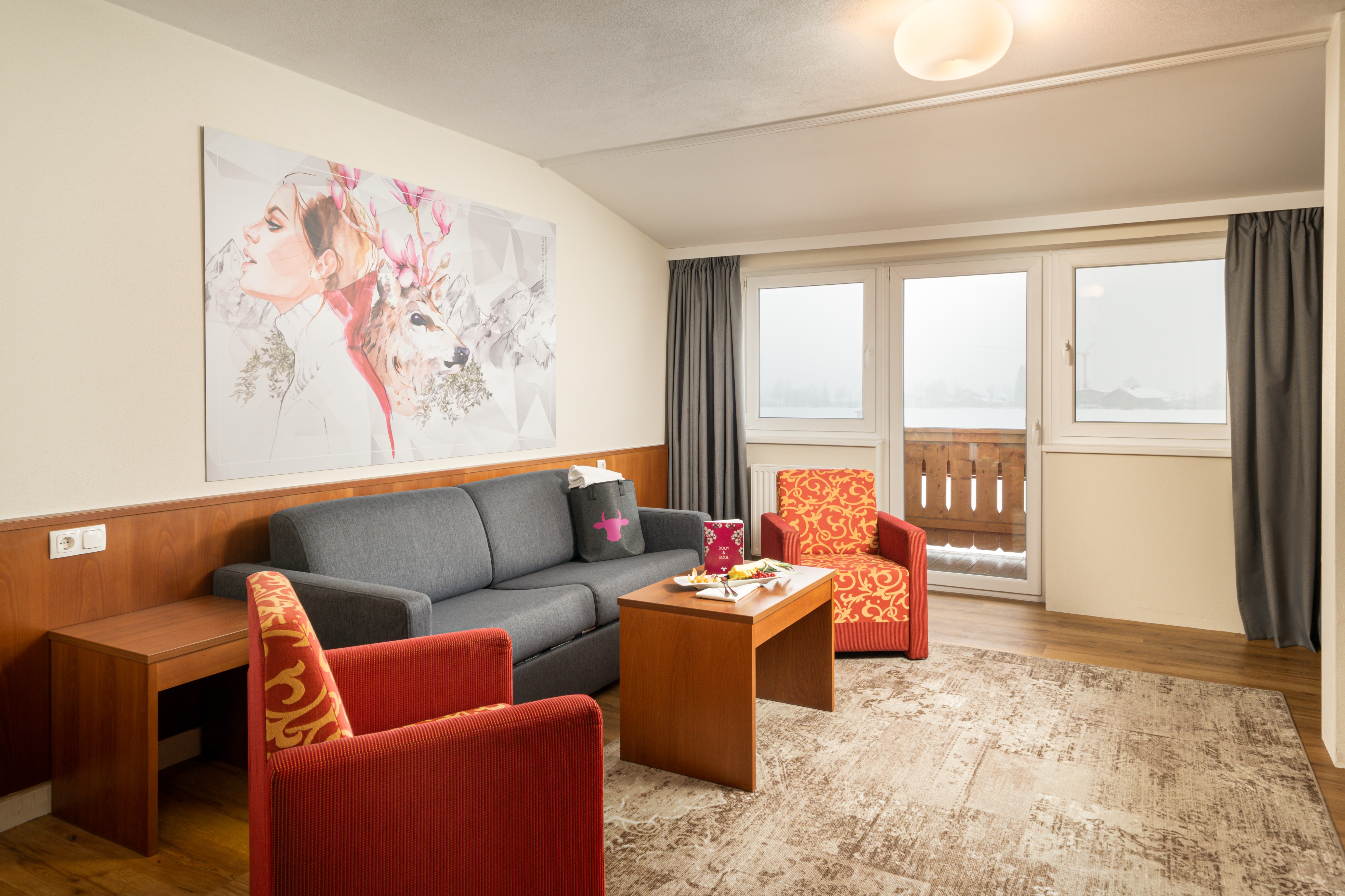 KUHOTEL Steinplatte, Trademark Collection by Wyndham suite living room in Waidring, Other than US/Canada