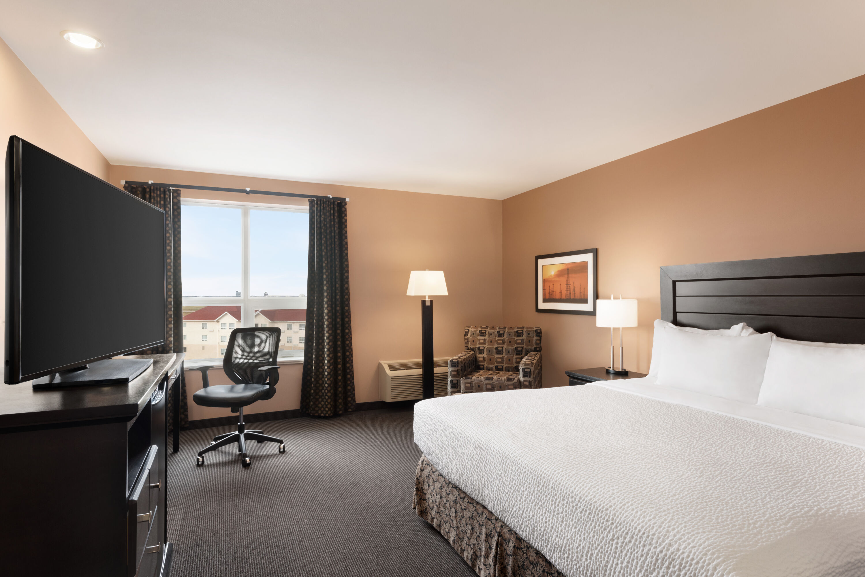 Guest room at the Royal Hotel Edmonton Airport Trademark Collection by Wyndham in Leduc, Alberta