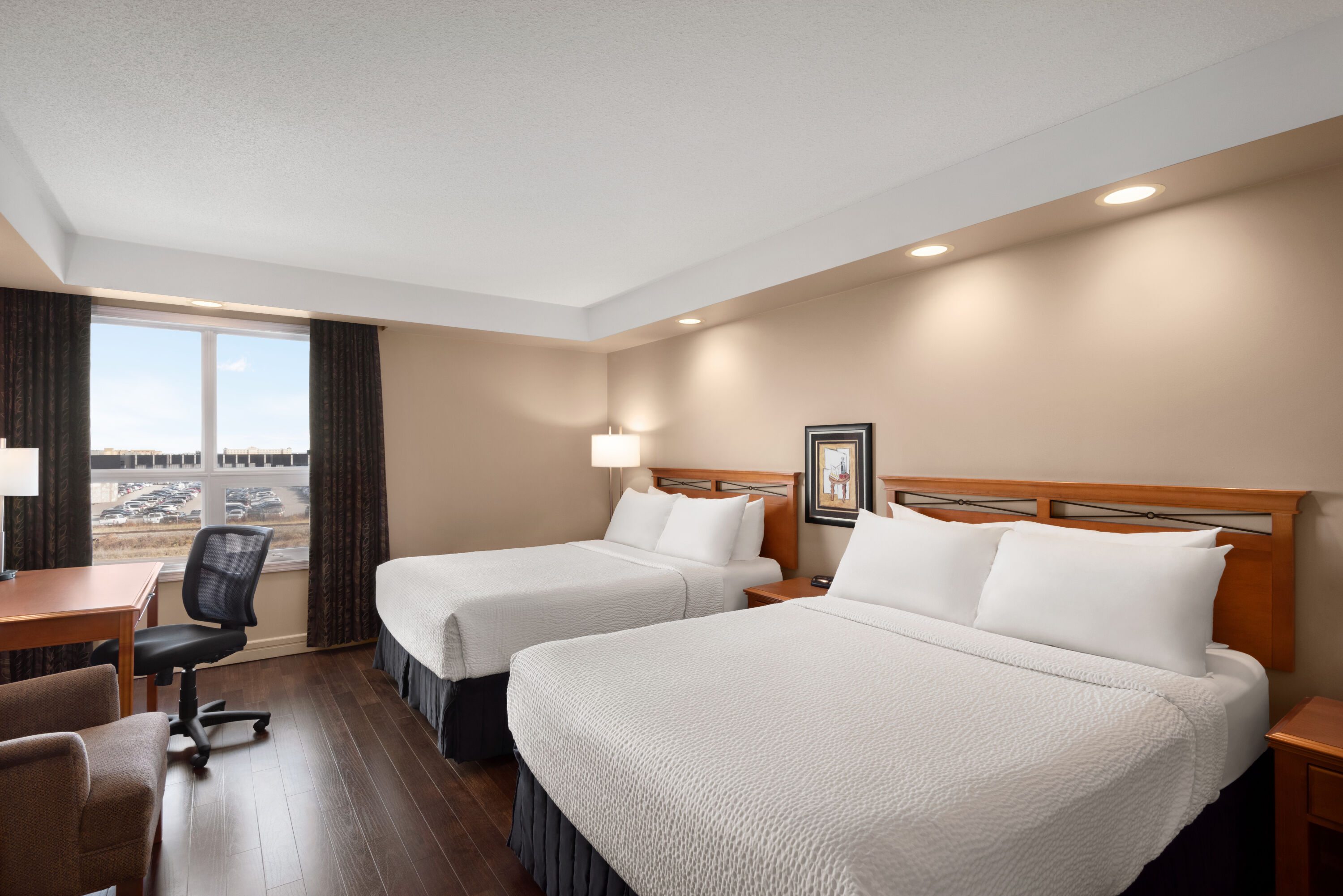 Guest room at the Royal Hotel Edmonton Airport Trademark Collection by Wyndham in Leduc, Alberta