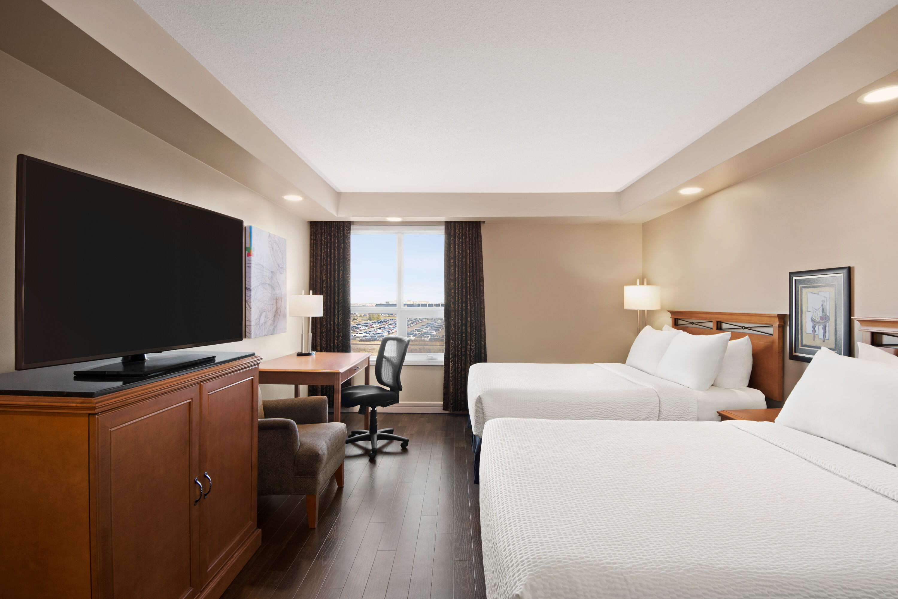 Guest room at the Royal Hotel Edmonton Airport Trademark Collection by Wyndham in Leduc, Alberta