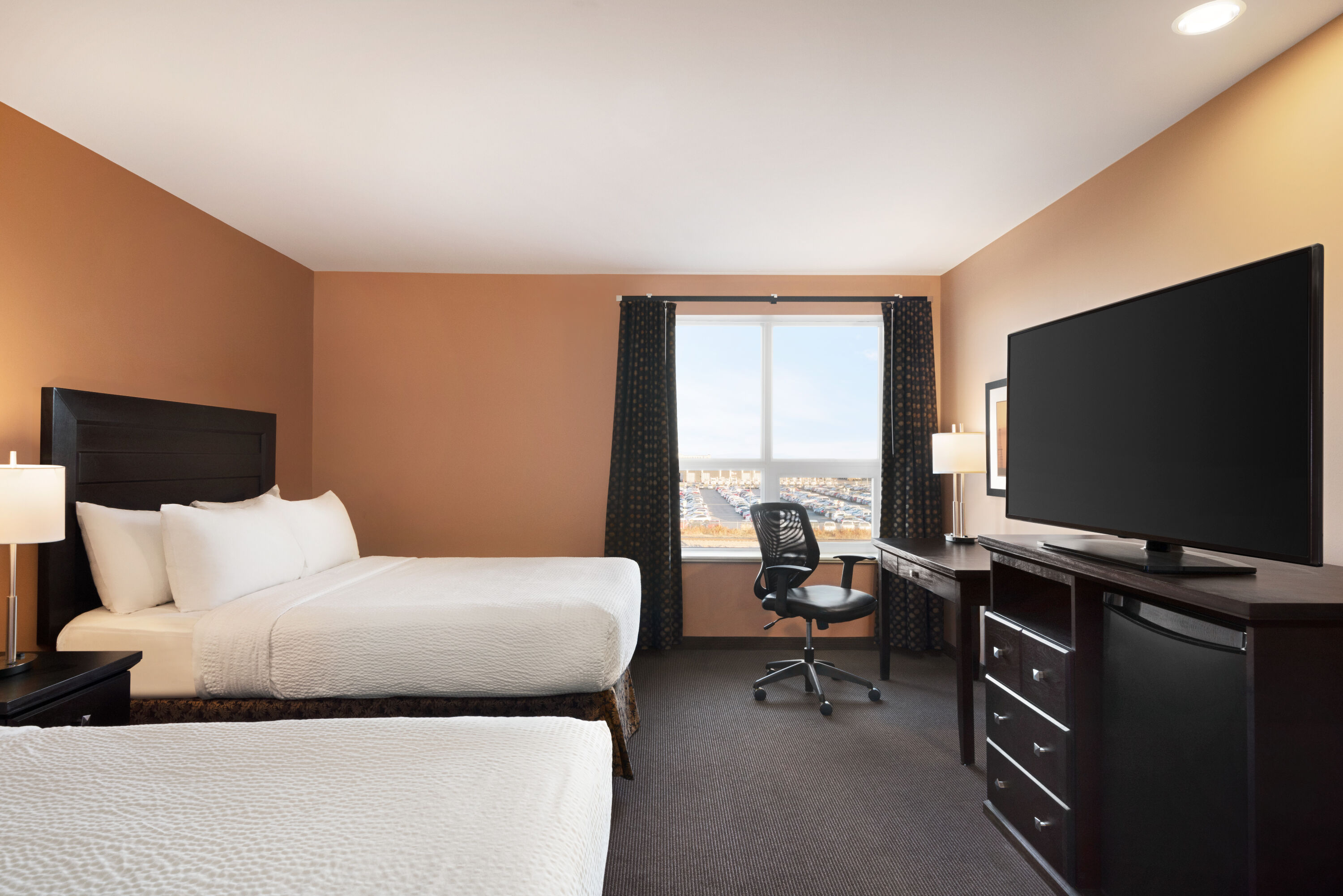 Guest room at the Royal Hotel Edmonton Airport Trademark Collection by Wyndham in Leduc, Alberta