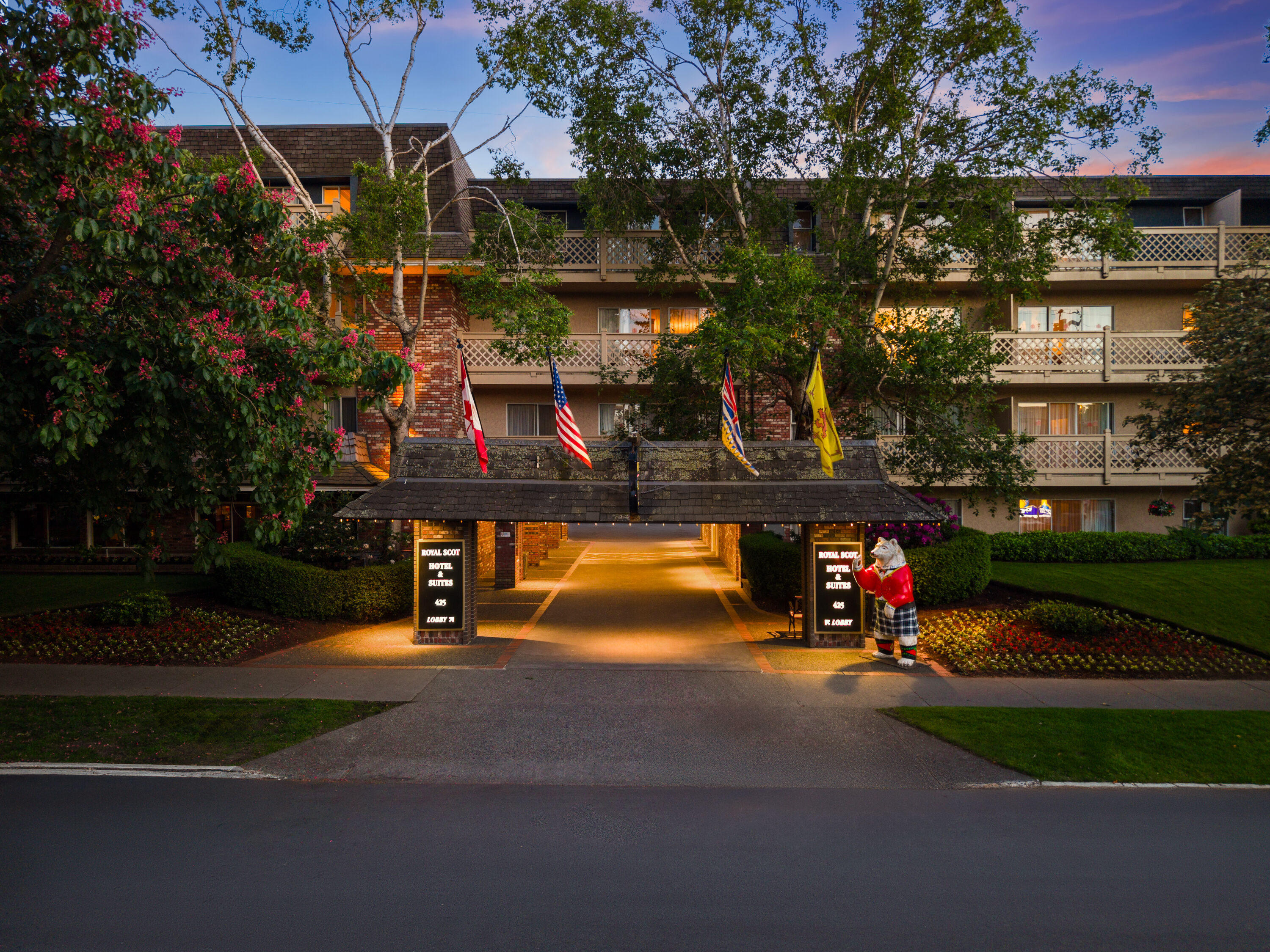 Exterior Dusk Image of Royal Scot Hotel & Suites, Trademark Collection by Wyndham hotel in Victoria, British Columbia