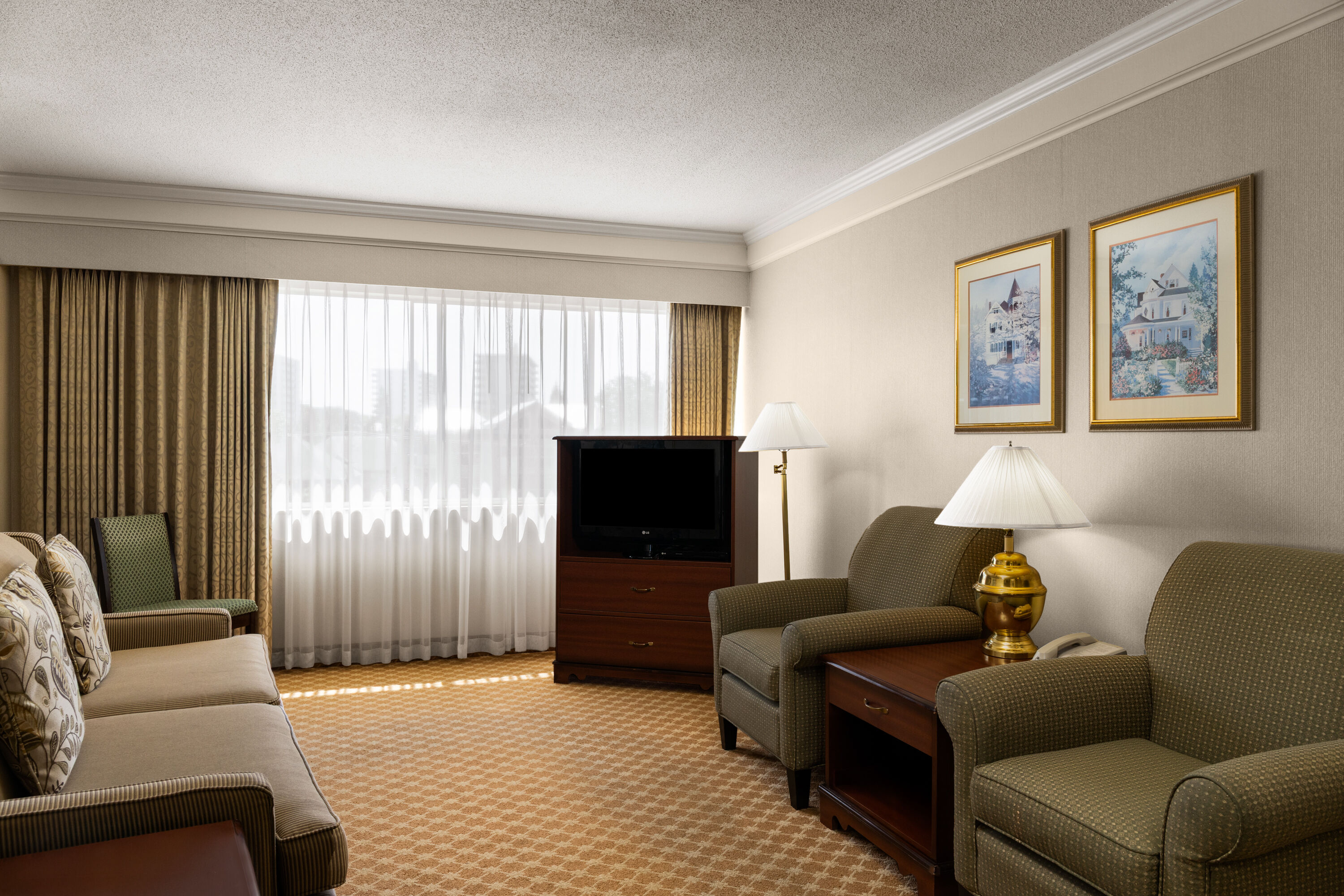 Guest room at the Royal Scot Hotel & Suites, Trademark Collection by Wyndham in Victoria, British Columbia