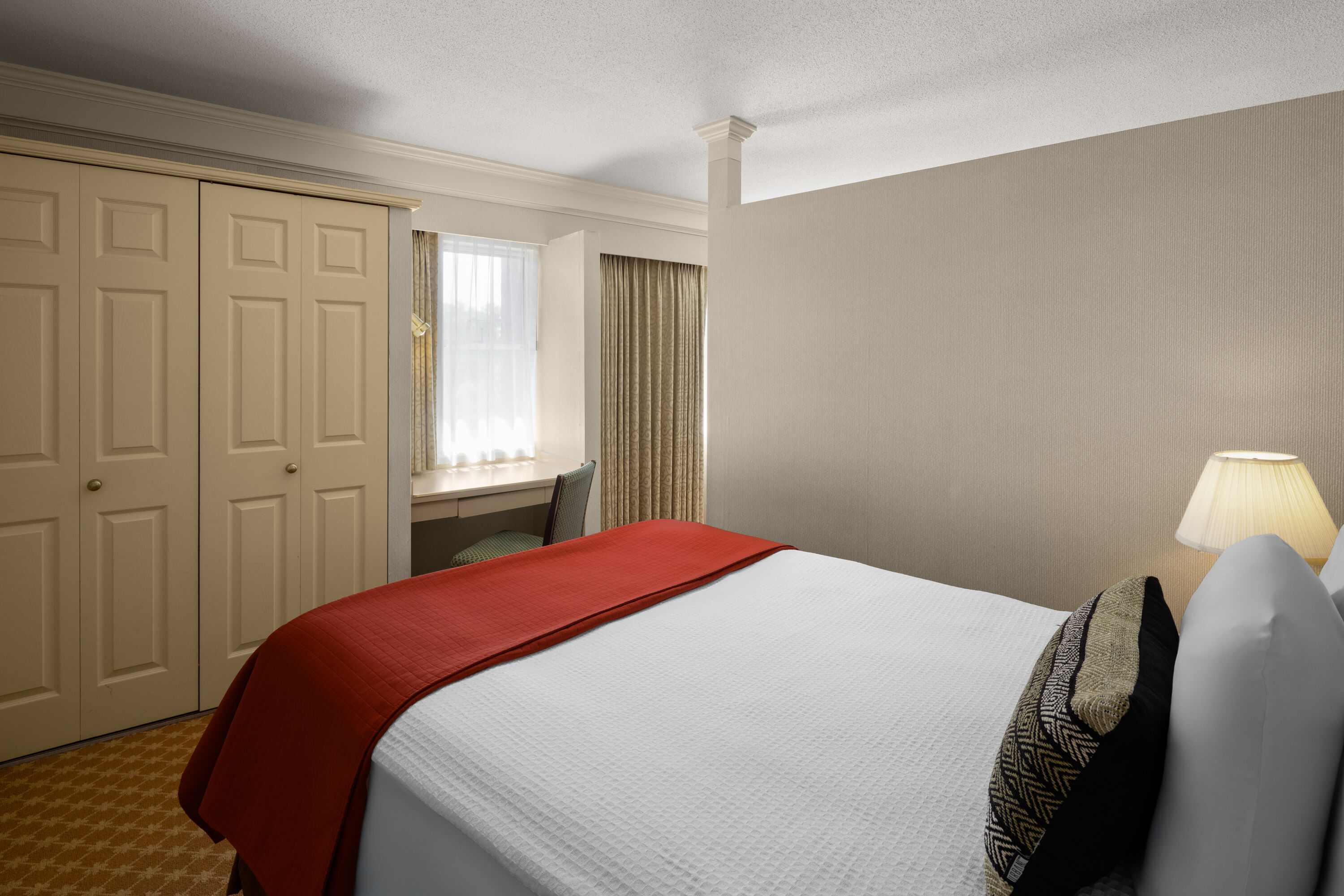 Guest room at the Royal Scot Hotel & Suites, Trademark Collection by Wyndham in Victoria, British Columbia