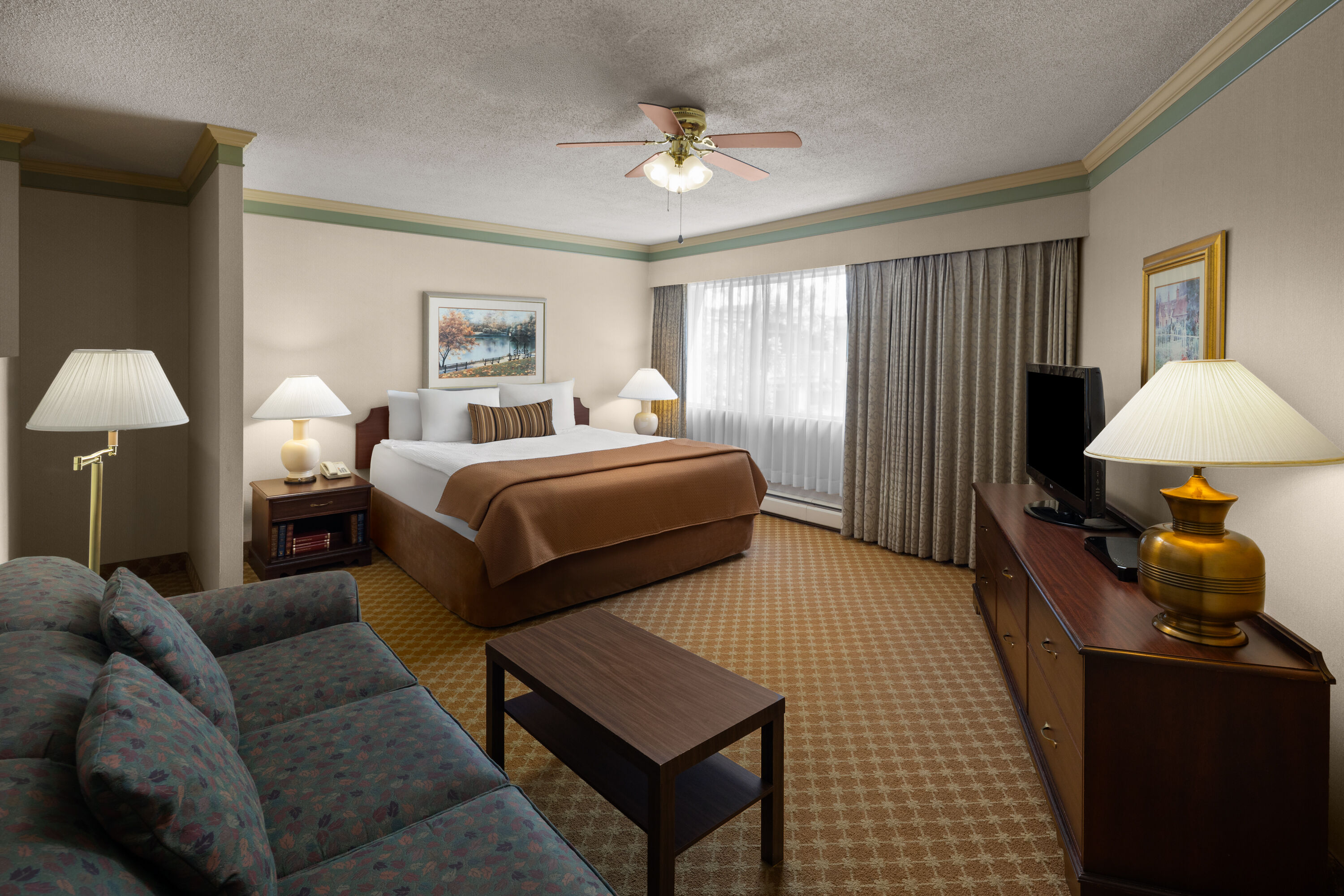 Guest room at the Royal Scot Hotel & Suites, Trademark Collection by Wyndham in Victoria, British Columbia