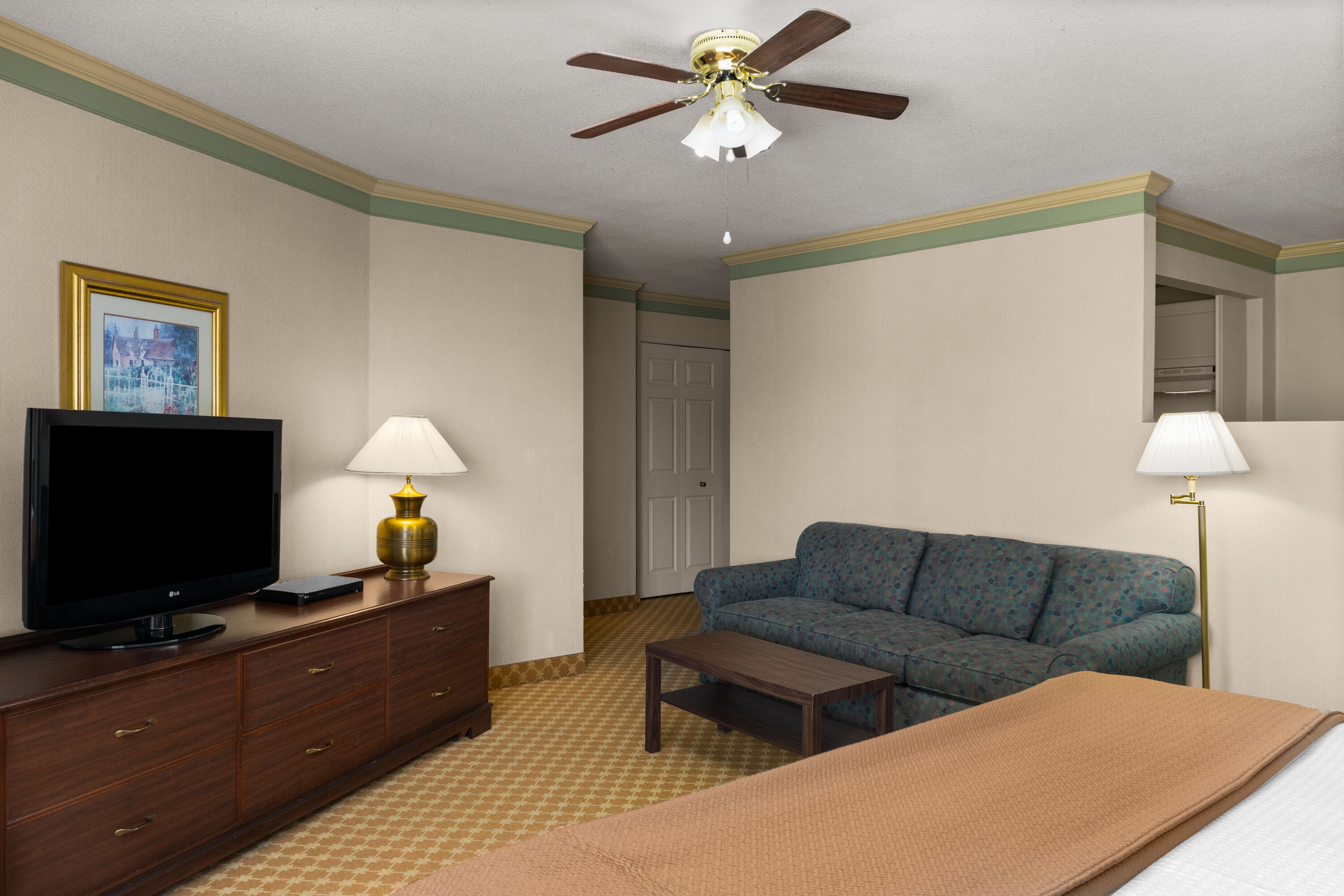 Guest room at the Royal Scot Hotel & Suites, Trademark Collection by Wyndham in Victoria, British Columbia