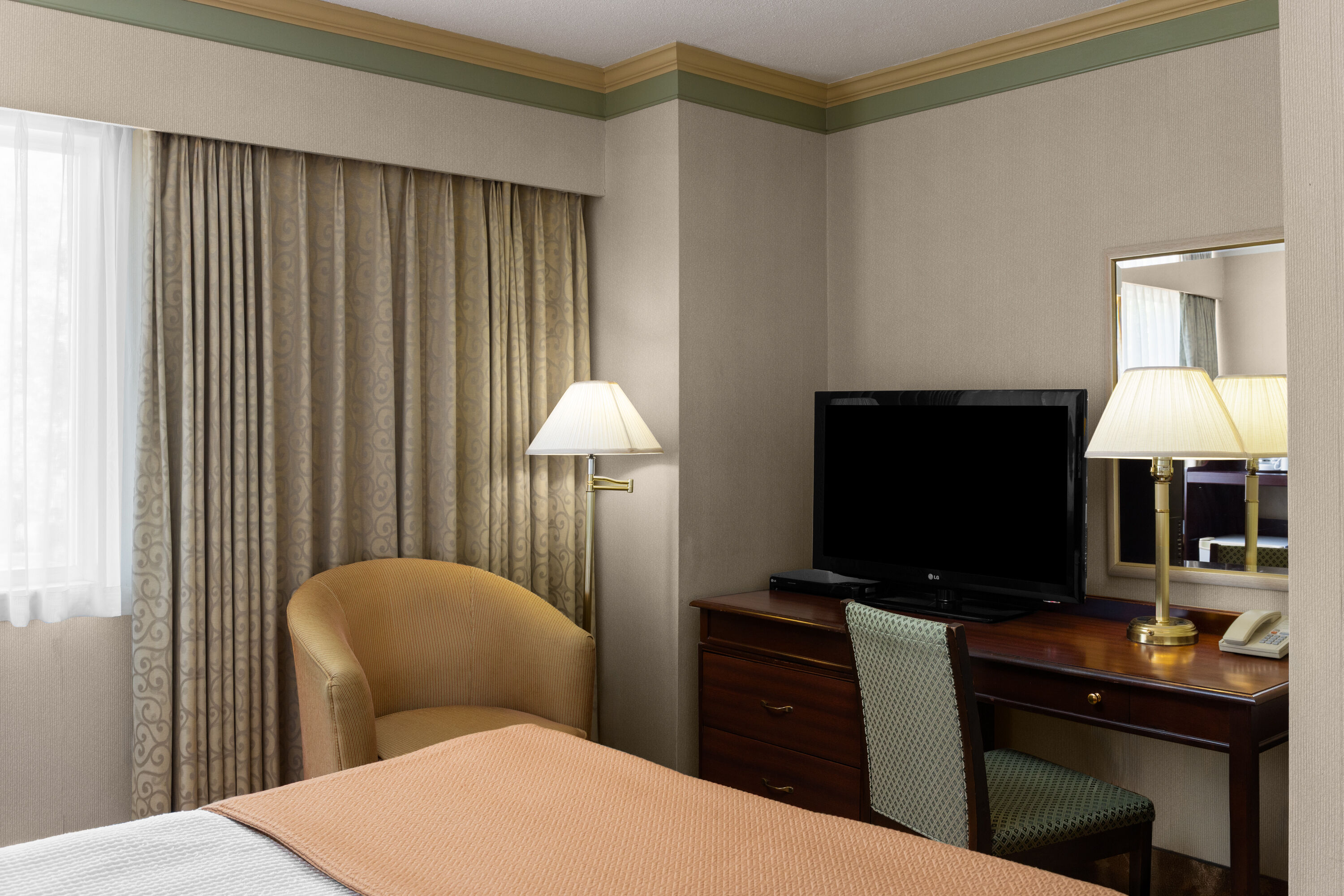 Guest room at the Royal Scot Hotel & Suites, Trademark Collection by Wyndham in Victoria, British Columbia