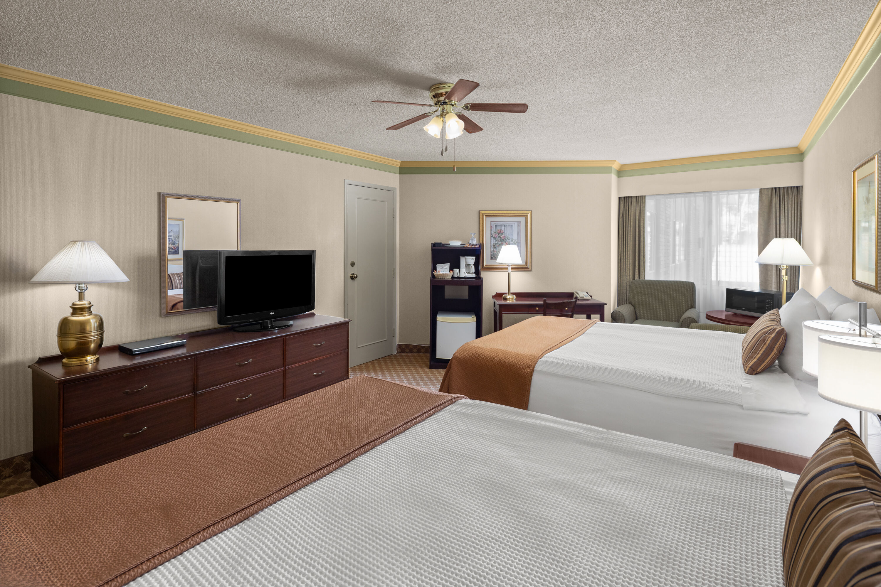 Guest room at the Royal Scot Hotel & Suites, Trademark Collection by Wyndham in Victoria, British Columbia