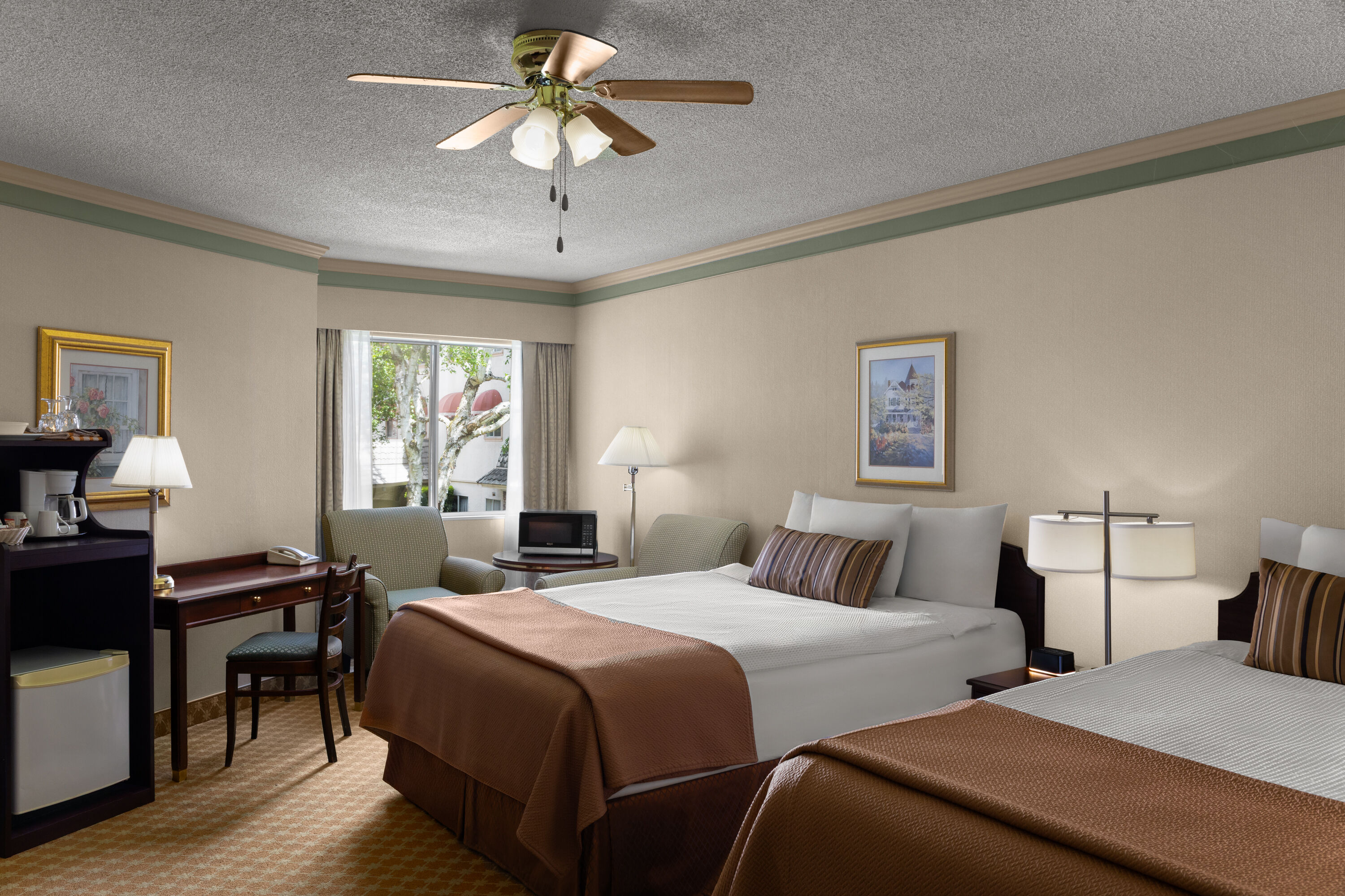 Guest room at the Royal Scot Hotel & Suites, Trademark Collection by Wyndham in Victoria, British Columbia